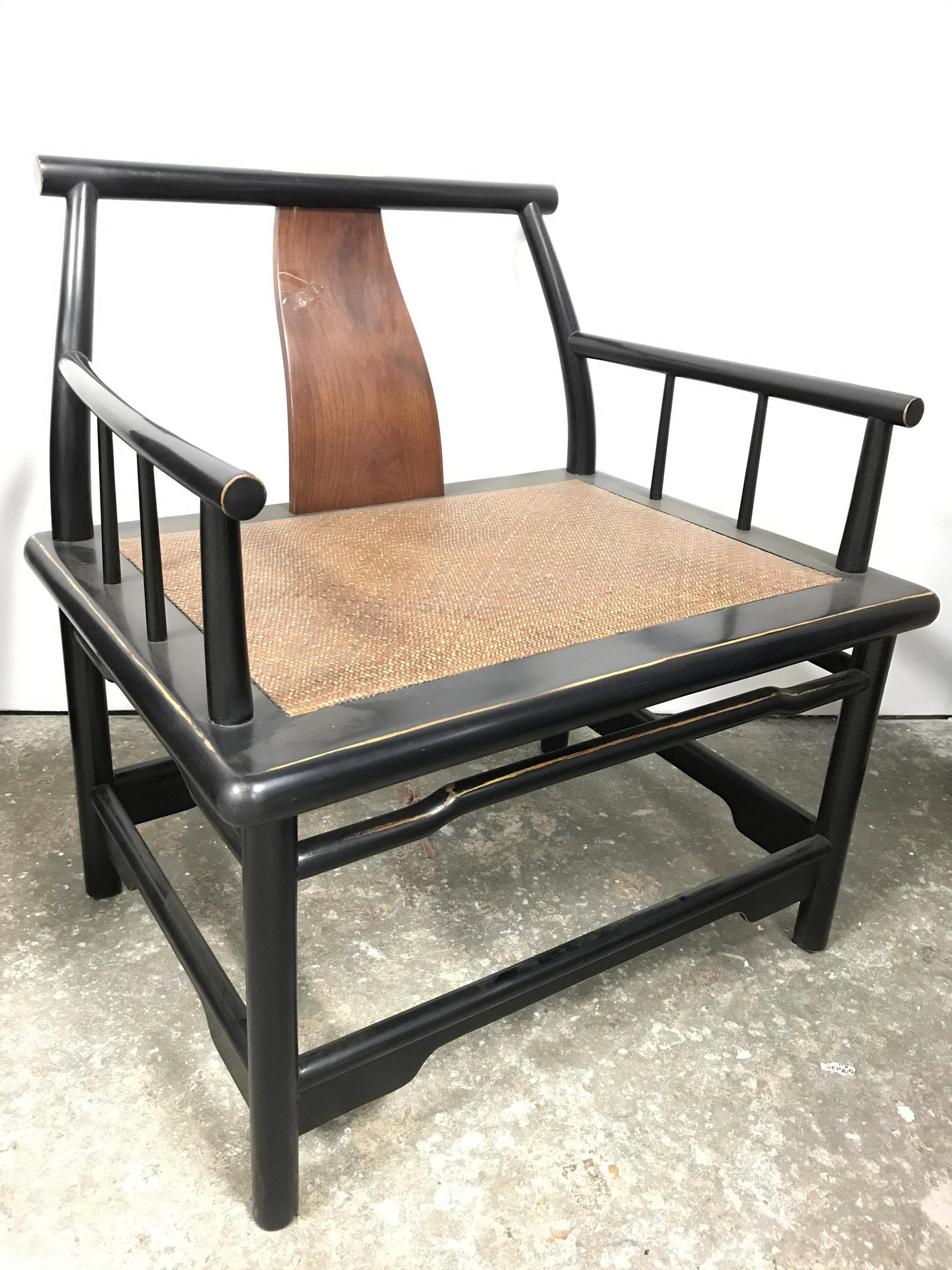 Antique Lacquered Asian Chair: Chair is possibly Huanghuali. Piece is black toned and lacquered. Piece has woven wicker/rush seat. Chair appears to be antique. Asian chair, antique Asian chair, antique Asian Furniture, Asian wooden