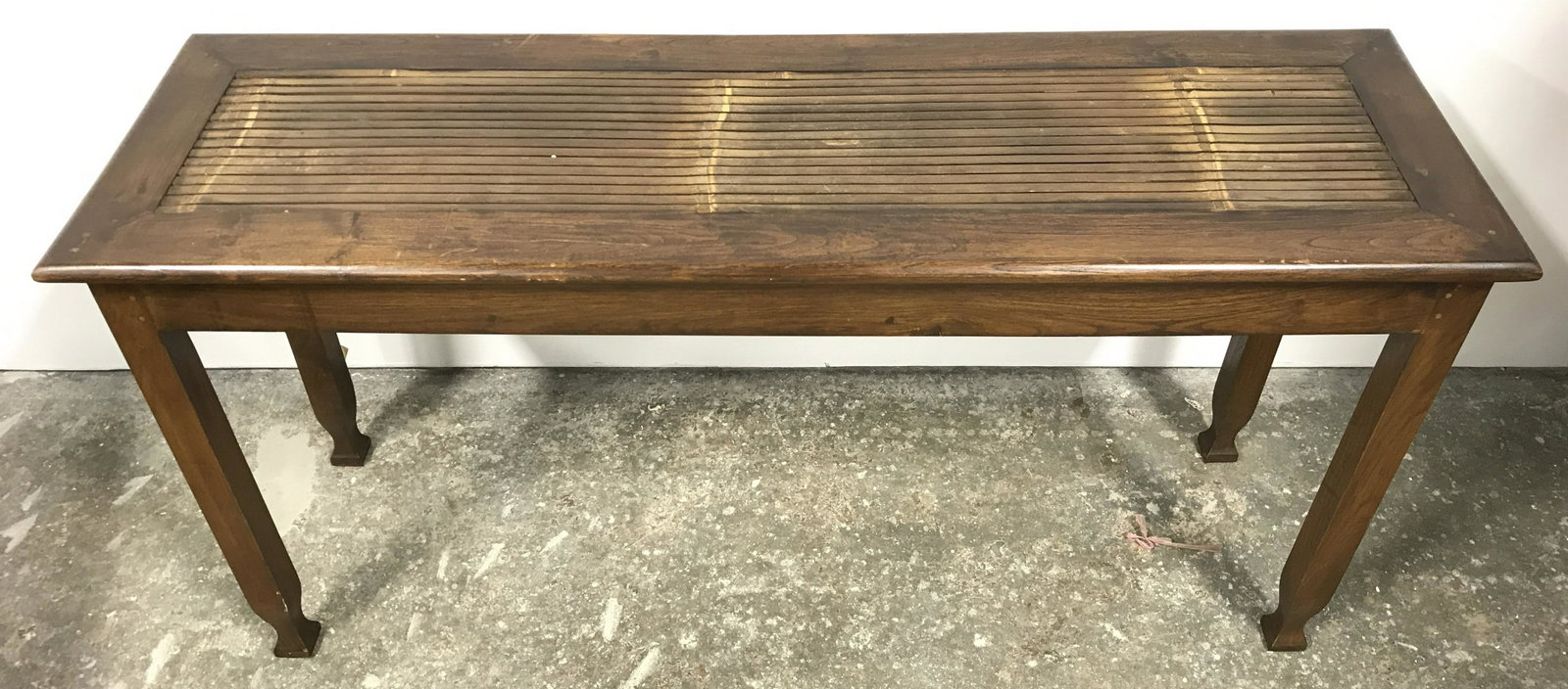 Slat Top Handcrafted Asian Style Console Table: Console table has slat top. Piece is brown toned and wooden. Piece has Asian influenced style. Appears to be vintage. Piece is hand crafted & possibly custom made. Piece has carved wooden feet. Measur
