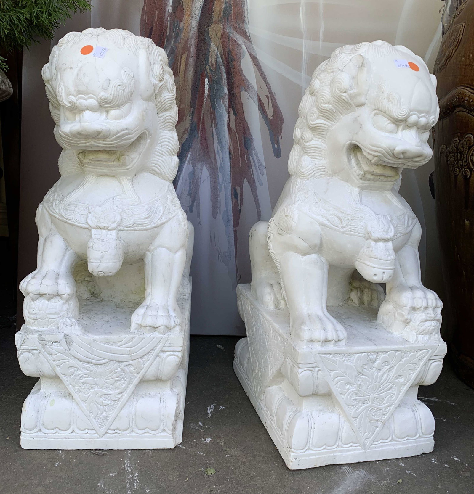 Pair Floor Size Asian White Marble Temple Lions: Pair of Asian temple lions, vintage possibly antique, foo dogs, chinese dragons, hand carved marble, each measures ht 29inches, d15 inches and width app 12 inches, each has raised paw foot resting on 