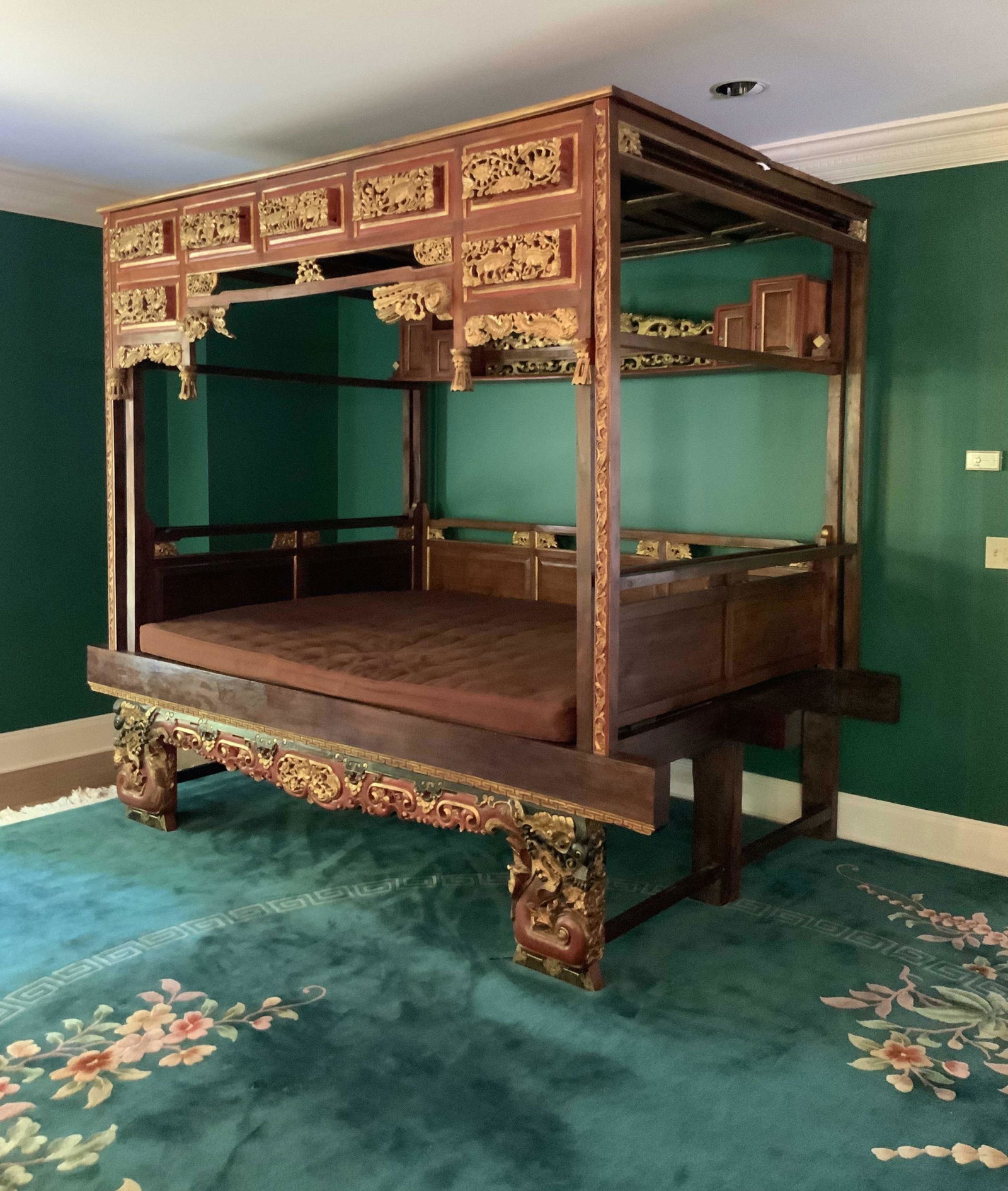 Grand Over-the-Top Carved Chinese Opium Bed: Vintage possibly antique Grand statement piece, dramatic sofa with original artwork,, Hand made hand carved hand gold leafed Asian opium bed, Chinese wedding bed, mattress approximately queen sized, c