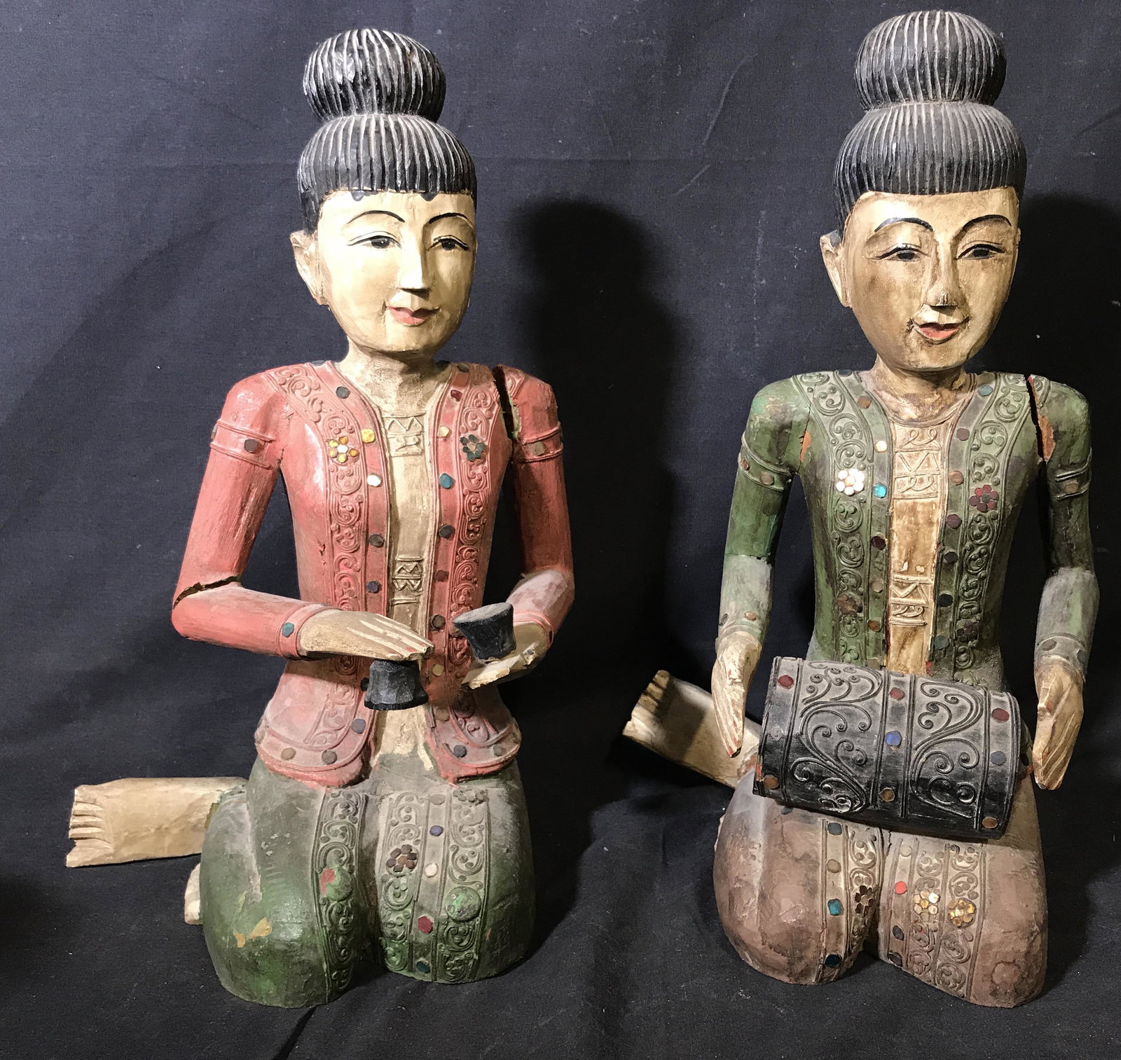 Pair Indian Style Solid Wood Sculptures: Pair of Indian Style solid wood sculptures, No apparent signatures or stamps to either, subject two seated wooden figures one holding what appears to be a drum and the other holds possibly two bells, 