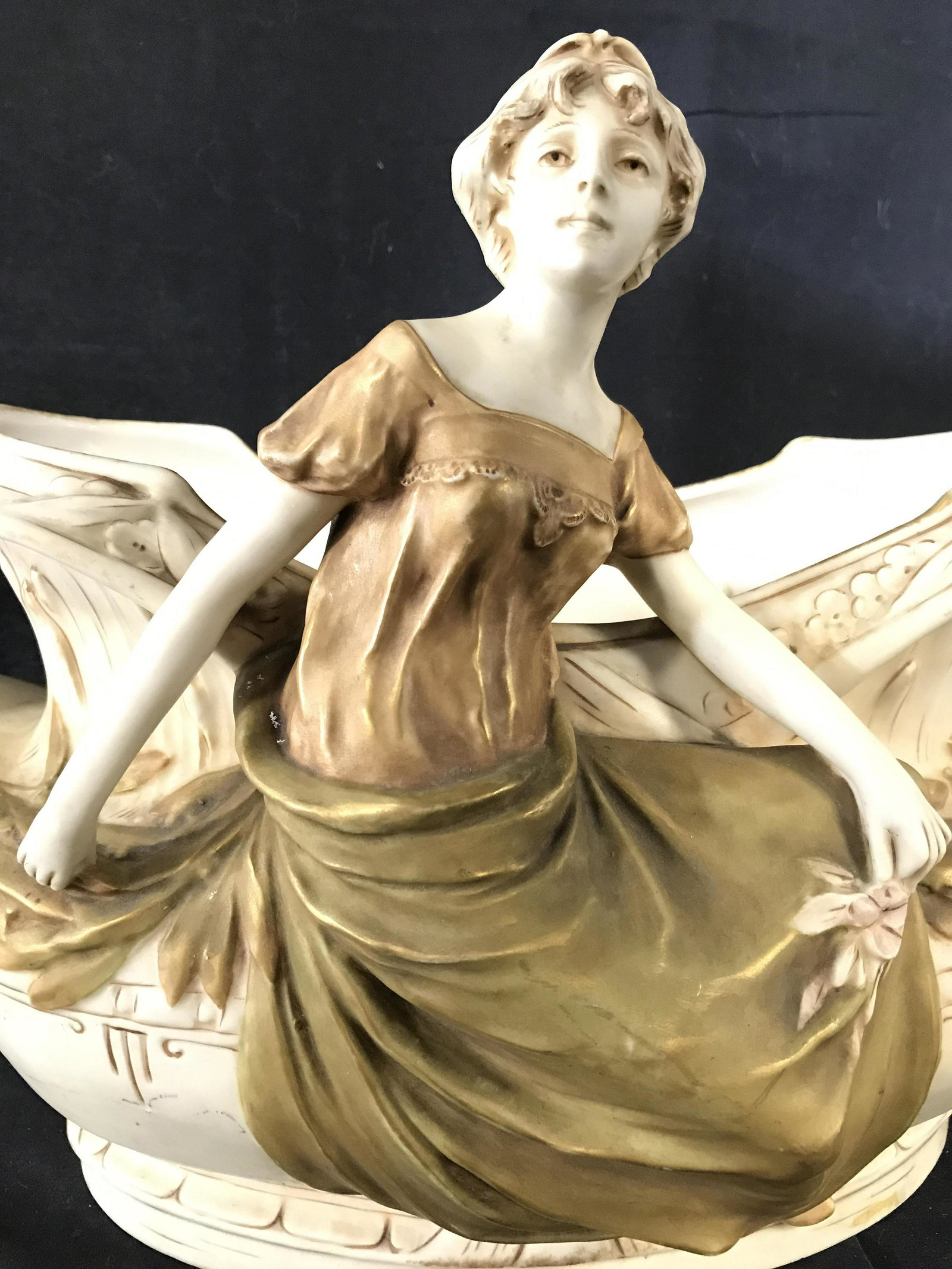 ROYAL DUX BOHEMIA Centerpiece: Underside of piece is marked ROYAL DUX BOHEMIA. Piece appears to be vintage. Piece is cream toned and has seated female figure. vase, planter, indoor garden accessory, porcelain planter, porcelain vas