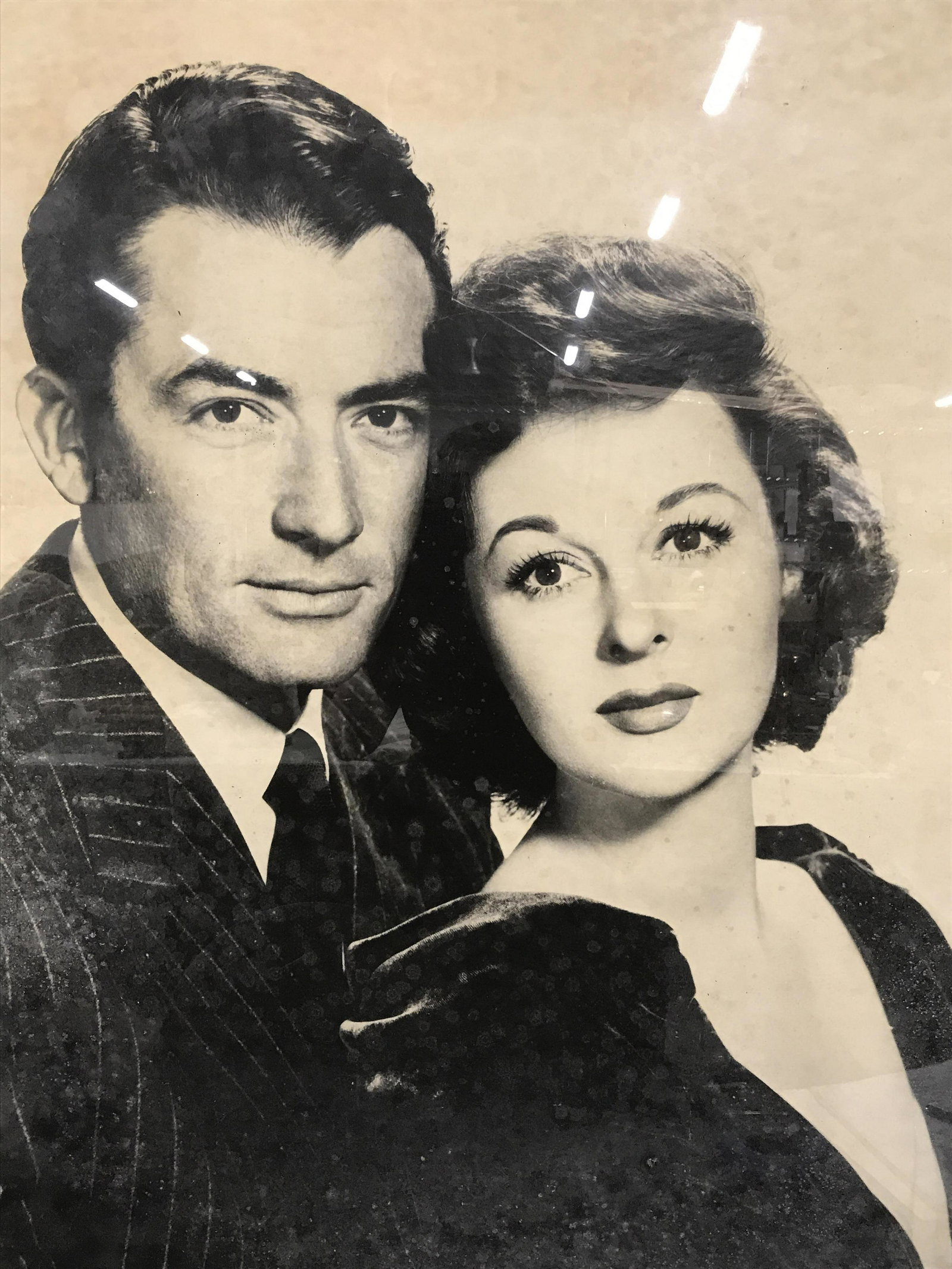Grand Framed Vintage Black & White Movie Poster: Framed vintage black & white movie poster, actors on poster Gregory Peck and Greer Garson / possibly Susan Hayward, some foxing to poster from age, oversized poster, black composite frame, measures 44