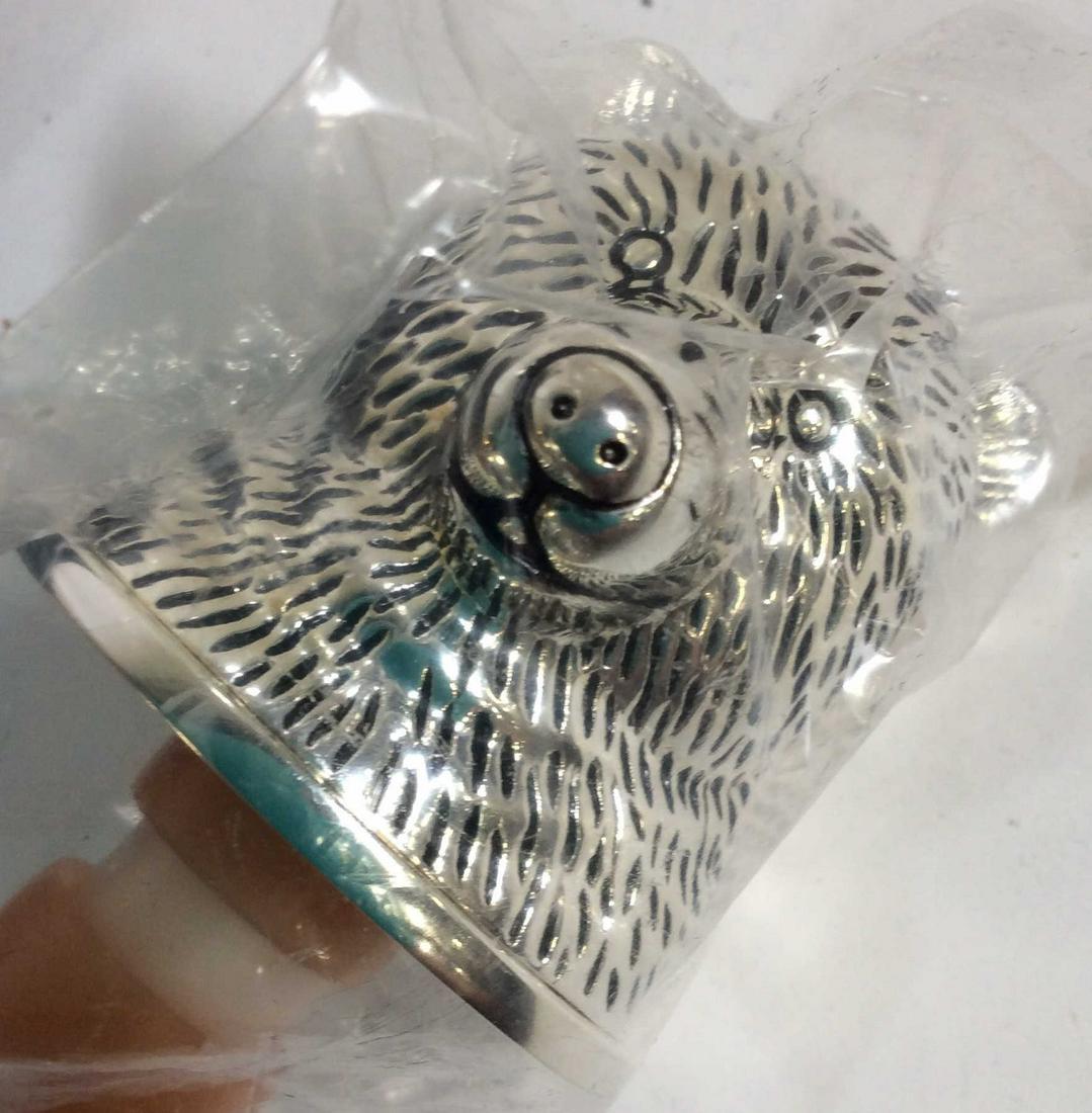 Pair Silver Tn Neiman Marcus Animal Wine Stoppers: Luxury Department Store Wine Stopper In Shape Of a Bear And a Bull. Never opened, remains in plastic package and sits in luxury black velvet box. Horn to bull will need repair. Stopper app 3 in ht. Ru