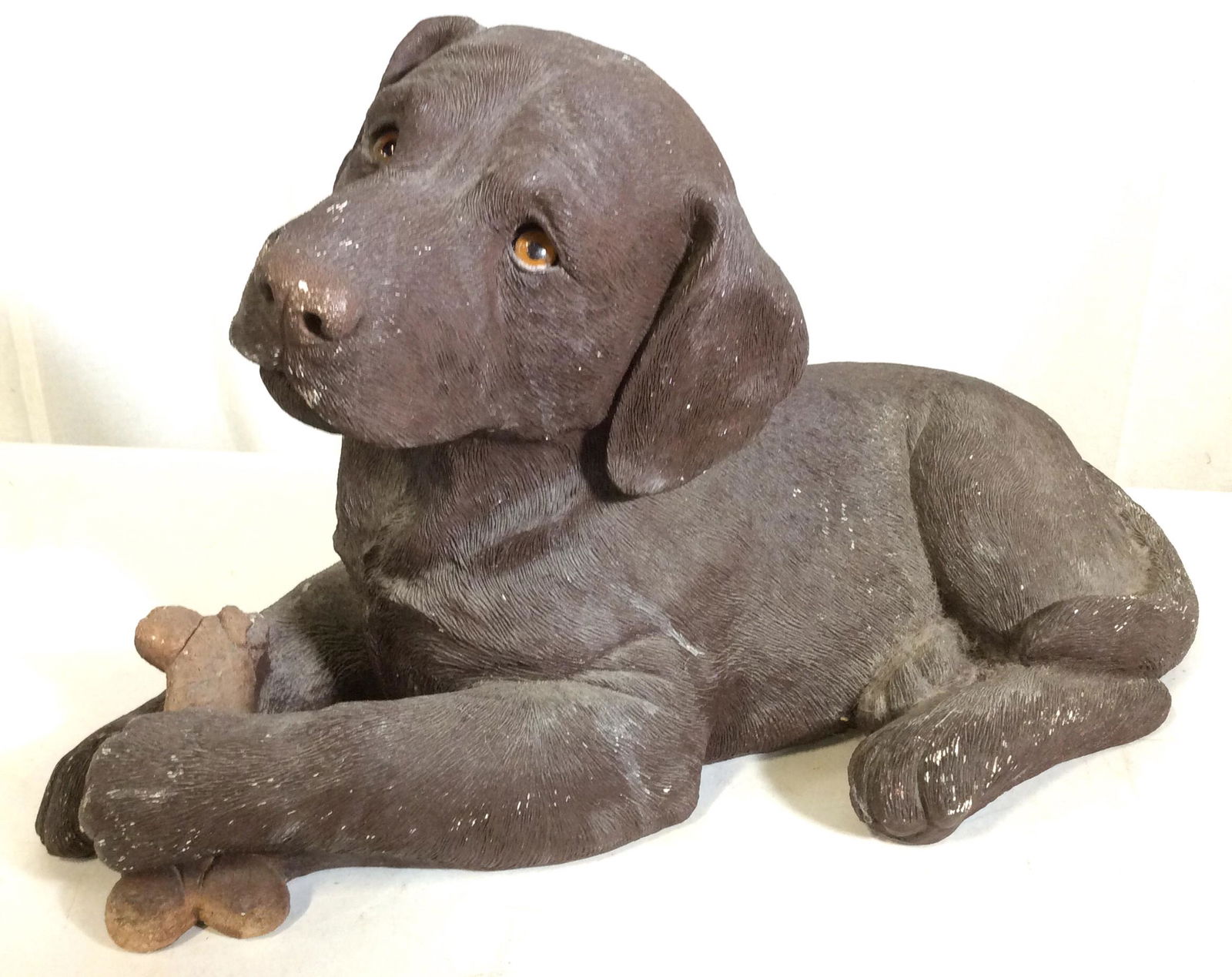SANDCAST Chocolate Lab Dog Ceramic Sculpture: SIGNED DOG SCULPTURE, Signed and labeled on underside Sandra Brue, Original Designer label. Piece is hand cast and Hand painted. Dated 1989 and copyrighted S. Blue. Chocolate Labrador Puppy with light