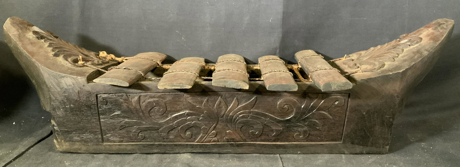 Far East Asian Wooden Boat Sculpture: Far East Asian Wooden Boat Sculpture, possibly Indonesian, no apparent inscriptions or signatures, sculpture comes with un removed sticker to base, not removed to preserve piece, a boat with vegetal d