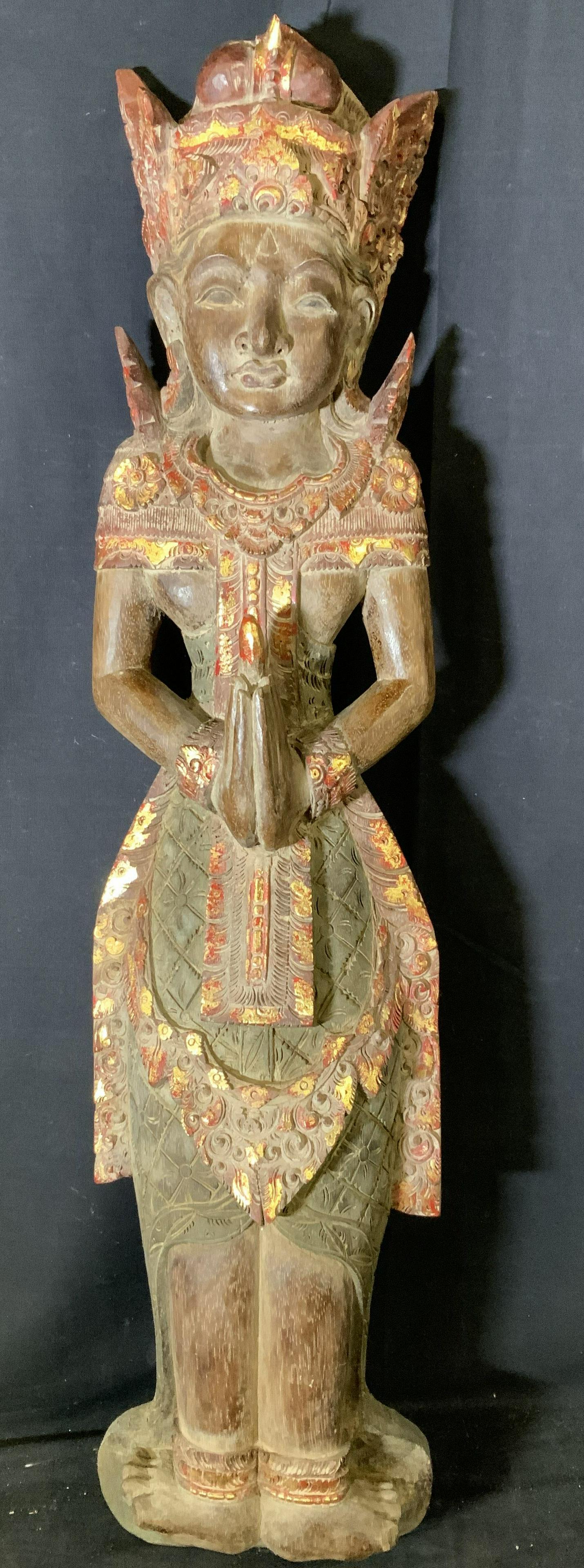 Far East Asian Polychrome Wooden Sculpture: Far East Asian Polychrome Wooden Sculpture, possibly Indonesian, no apparent signatures or inscriptions, a figure in traditional south Asian clothes with hands in namaste gesture, Measures 39 1/2 x 9 
