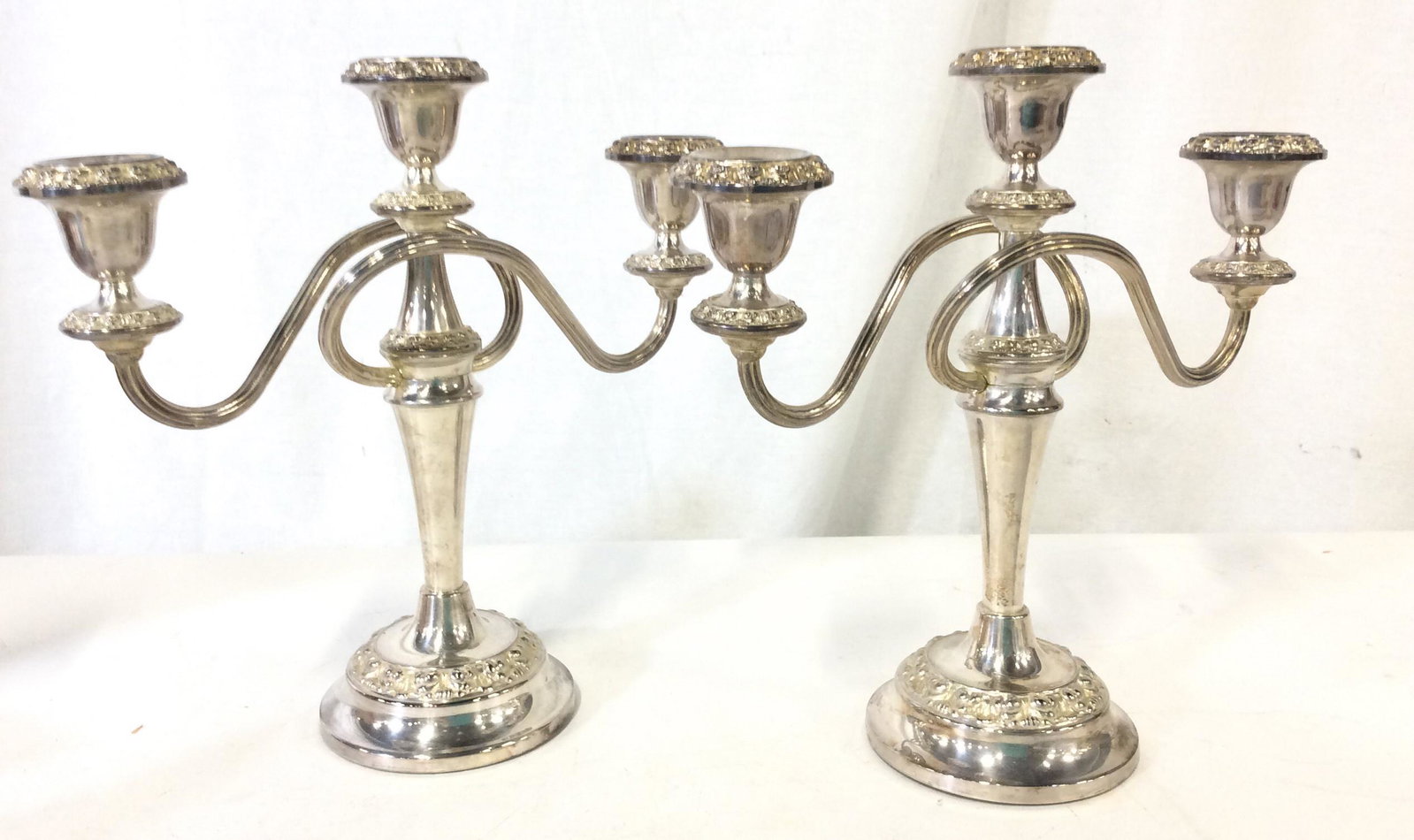 S. Plated Pair Candelabras From QEII Voyage: Three candle Pillar Tabletop Candelabras, embossed Detail similar to Art Nouveau Style, Silver Plated, felted bottom. They have removable bou baches for tapered candles. Candle diameter app 5/8 in.- 3