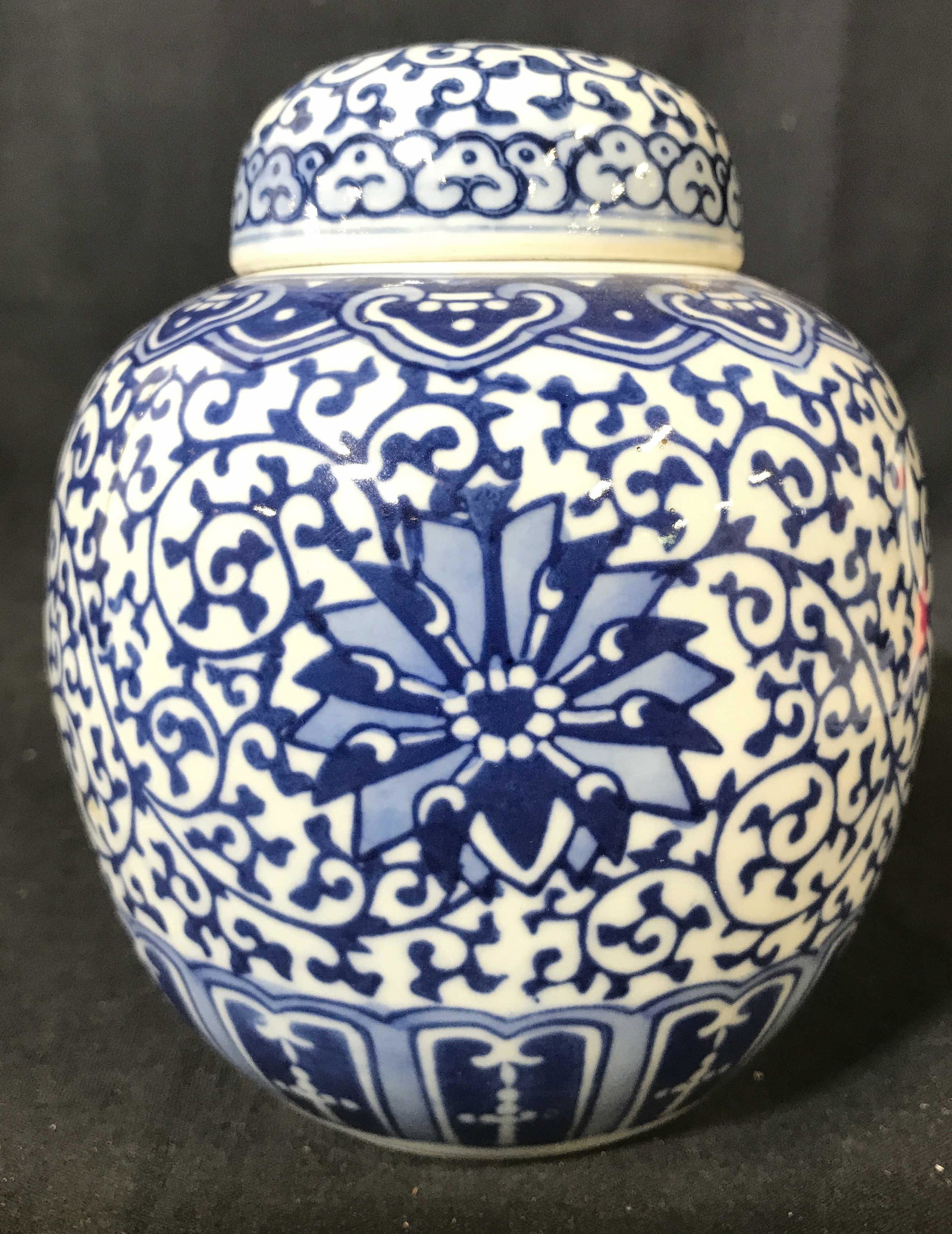 Antique Asian Porcelain Chinoiserie Ginger Jar: Urn is antique and porcelain. Piece is white with blue toned floral, vine, leaf and geometric detail. Piece includes lid. Urn measures approximately 6 inches tall 5 inches wide. Urn has 2 painted ring
