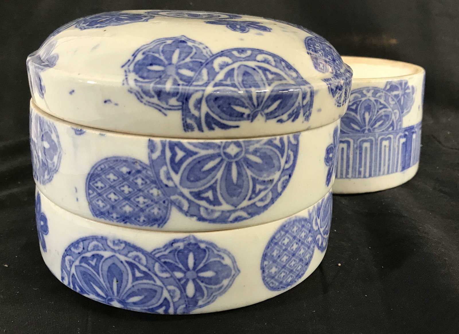Vintage Multi Tier Porcelain Asian Tiffin Bento Bo: Lunchbox is Asian & porcelain. Piece is white with blue toned medallion detail. Lunchbox includes 3 tiers & lid. Piece when put together measures approximately 8 inches tall 6 inches wide. Asian lunch