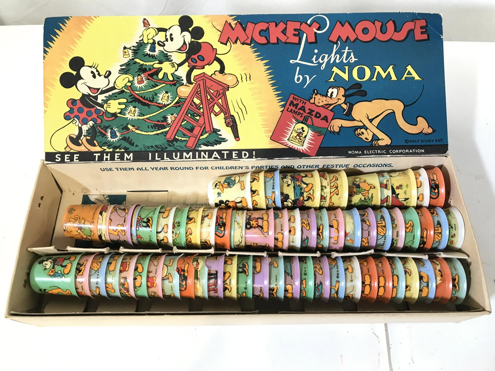 Collectible Disney Light Covers In Orig Box: Lot includes 64 light covers. Pieces depict various, Disney characters such as Donald Duck, Mickey Mouse, Goofy and more. Each measures approximately 2 inches tall 1.5 inches wide. Pieces include orig