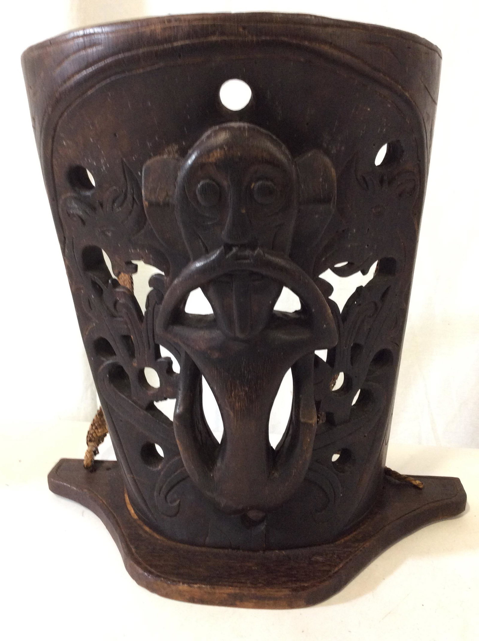 Borneo Hand Carved Dayak Baby Carrier, Indonesia: Possibly dating to late/early 19C/20C., Borneo Dayak Tribal Wooden Carved Baby Carrier w MONKEY FIGURAL. Dark wood, APPEARS STAINED, carved from one piece, exception to base which is a removable flat 