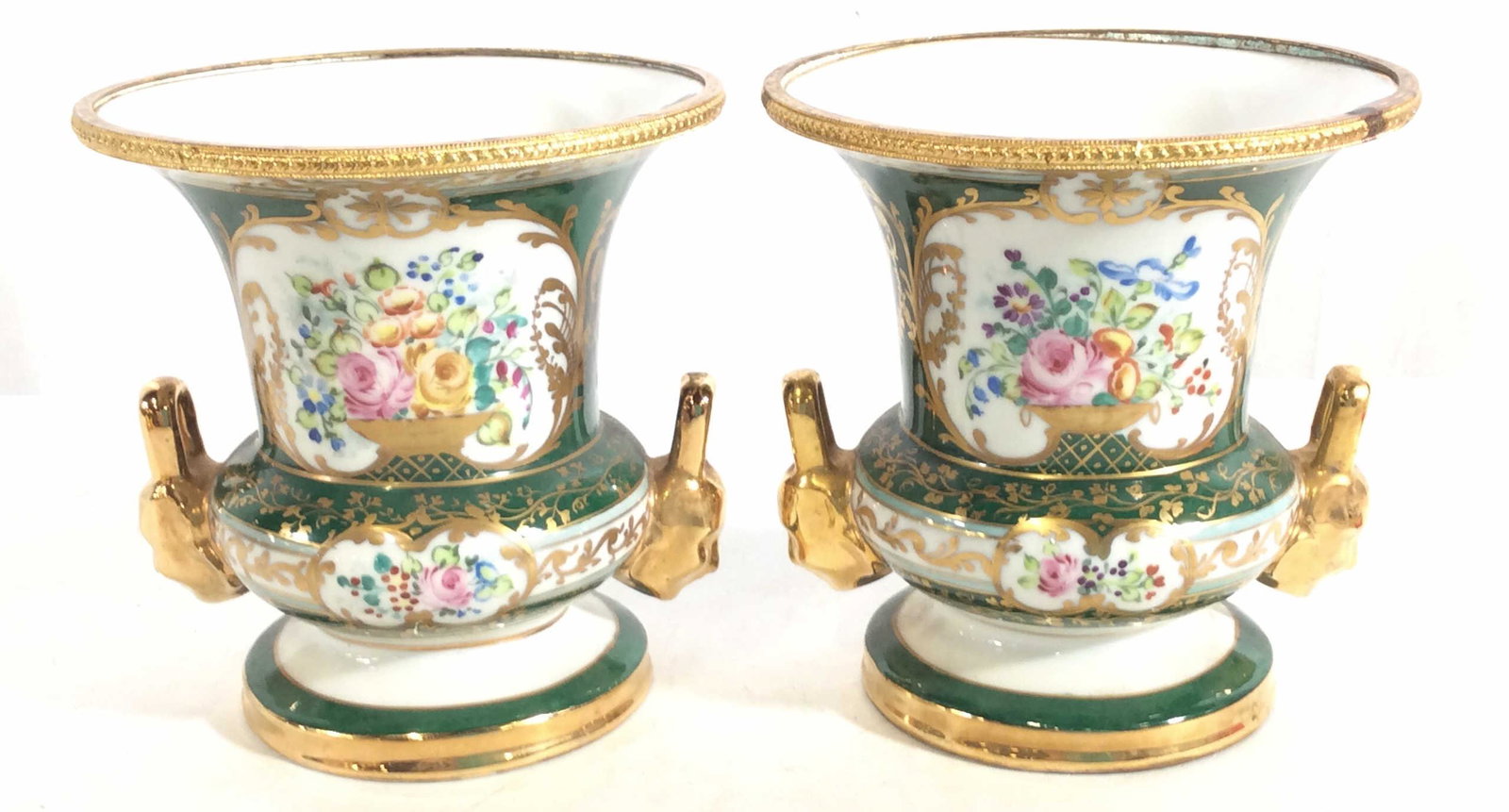 Pair Signed J. POUYAT LIMOGES Porcelain Gilt Urns: Old Paris, possibly antique, French Porcelain Urns. Green with beautiful Gilt laurels And Hand Painted throughout, Gilt human form griffin handles, Gold Tone Metal rim. Measure 5.5 in diameter, 6 in h