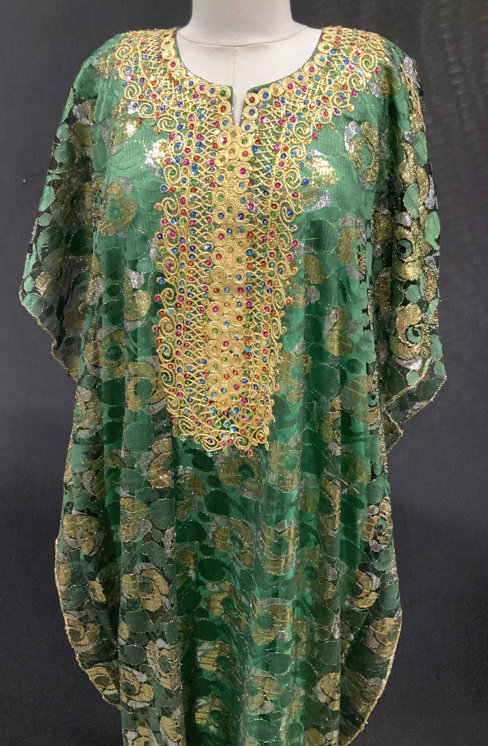 Embroidered Women’s Caftan: Embroidered women’s caftan, possibly Indonesian, crew neck, dolman sleeve, yellow thread embroidery, multicolored sequins, mesh attached to green slip, size: medium to large, measures 50 inches in l