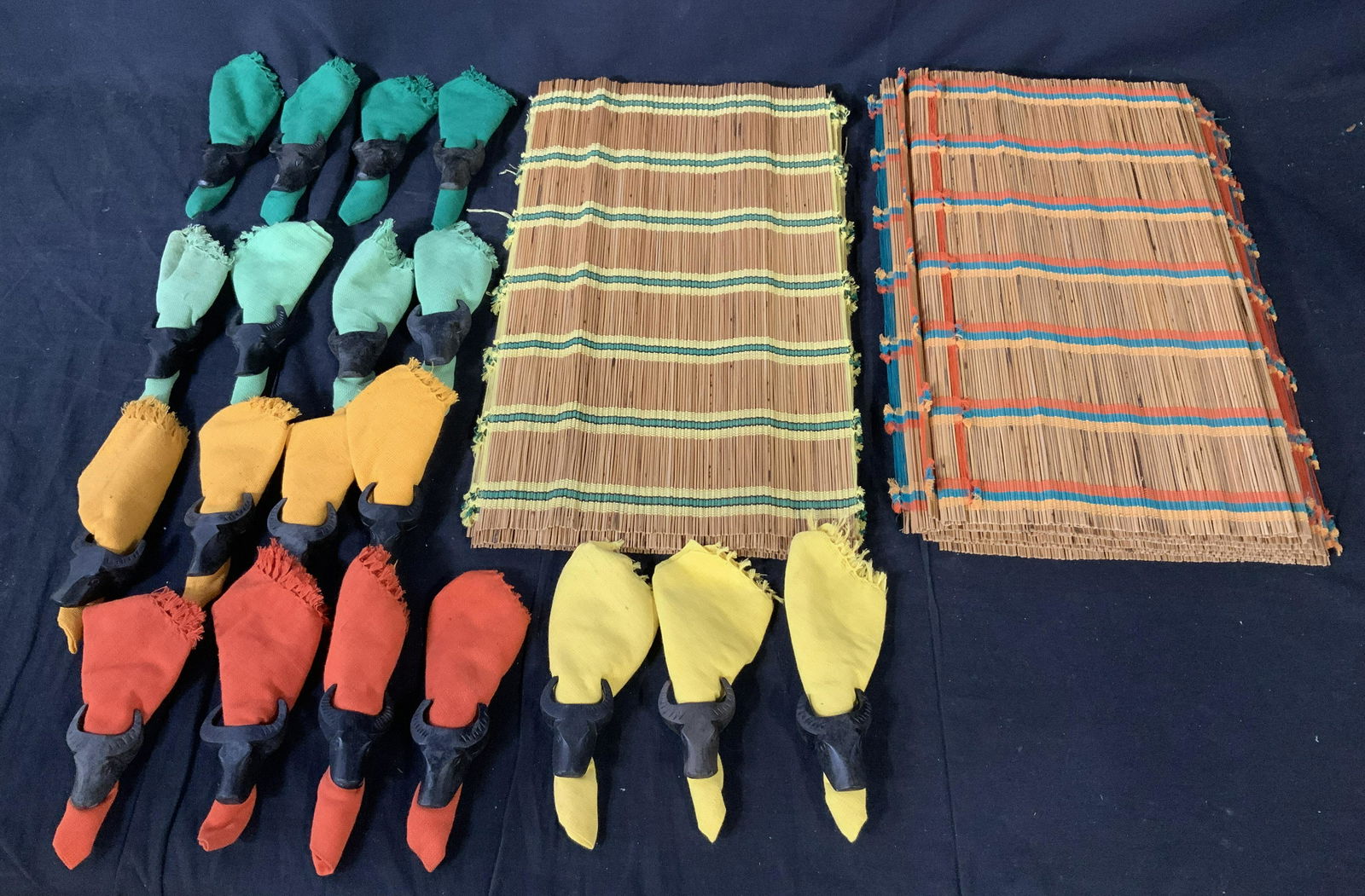 Lot 37 Filipino Placemats Napkin Holders & Napkins: Lot 37 Filipino Placemats Napkin Holders & Napkins, label to pieces reads ‘Made in Philippines, 19 napkins and napkin holders, 18 place mats, napkin holders are hand carved and bull shaped, napkins