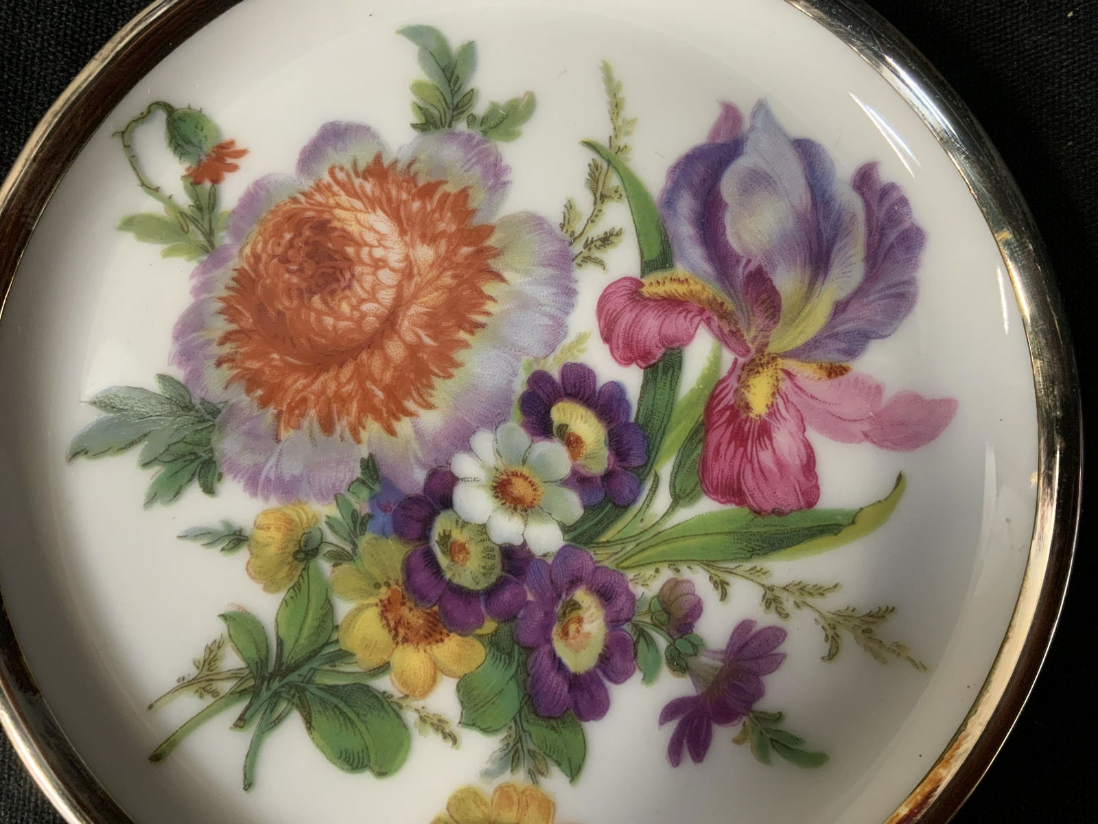 Pair Feinsilber Auflage Porcelain Coasters: Pair Feinsilber Auflage Porcelain Coasters, stamp to base reads ‘W Germany’, ‘1000/1000 Feinsilber Auflage Gebroder de Vhle’, painted floral design, rim painted silver, new in box, never used,