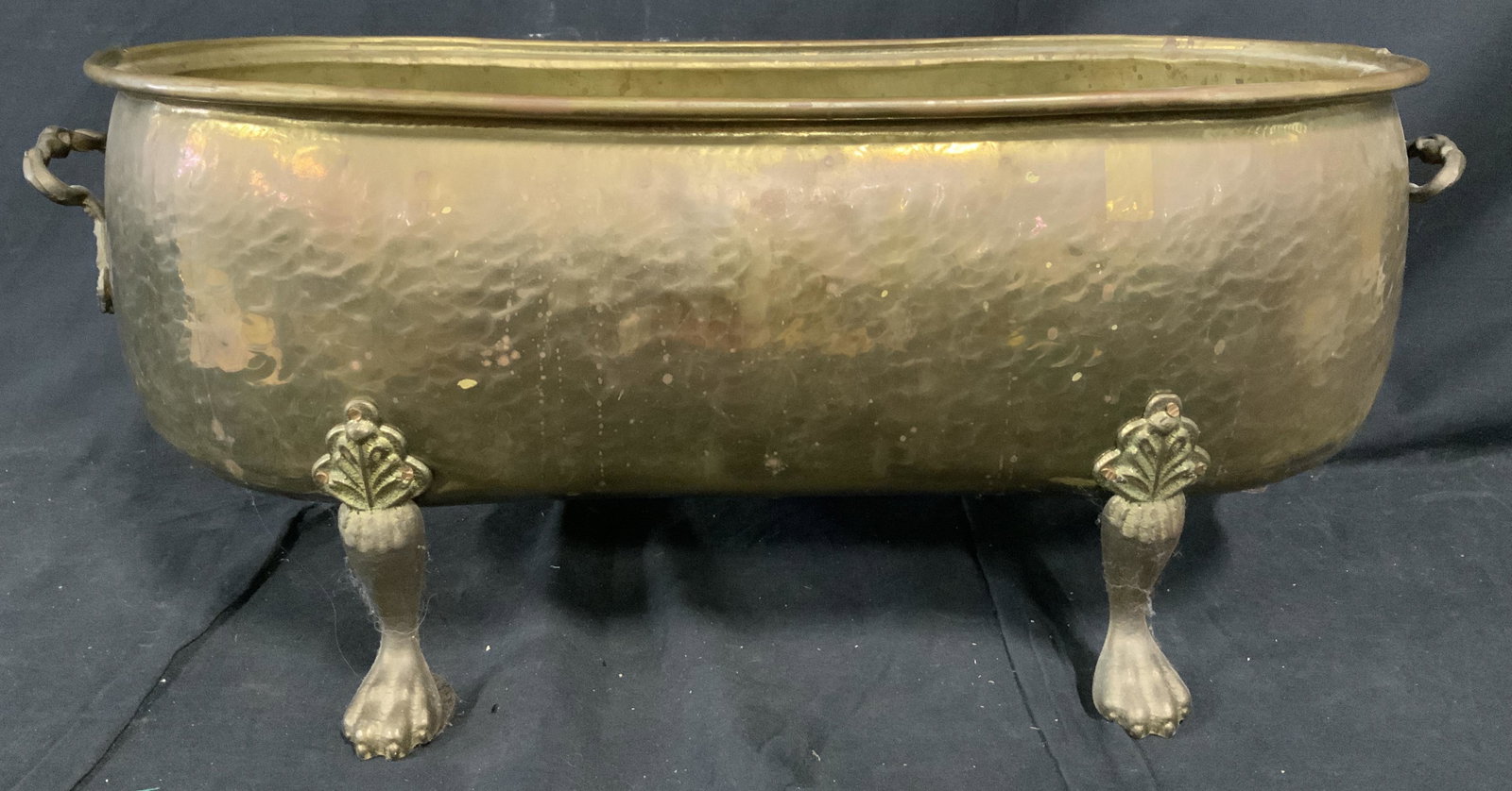 Claw Foot Cache Pot Metal Planter: Metal Planter, no apparent inscriptions or stamps, two handles, Lion foot detailed feet, brass toned metal, measures 11 1/8 inches tall x 28 inches at widest point, has wear from use but overall in go