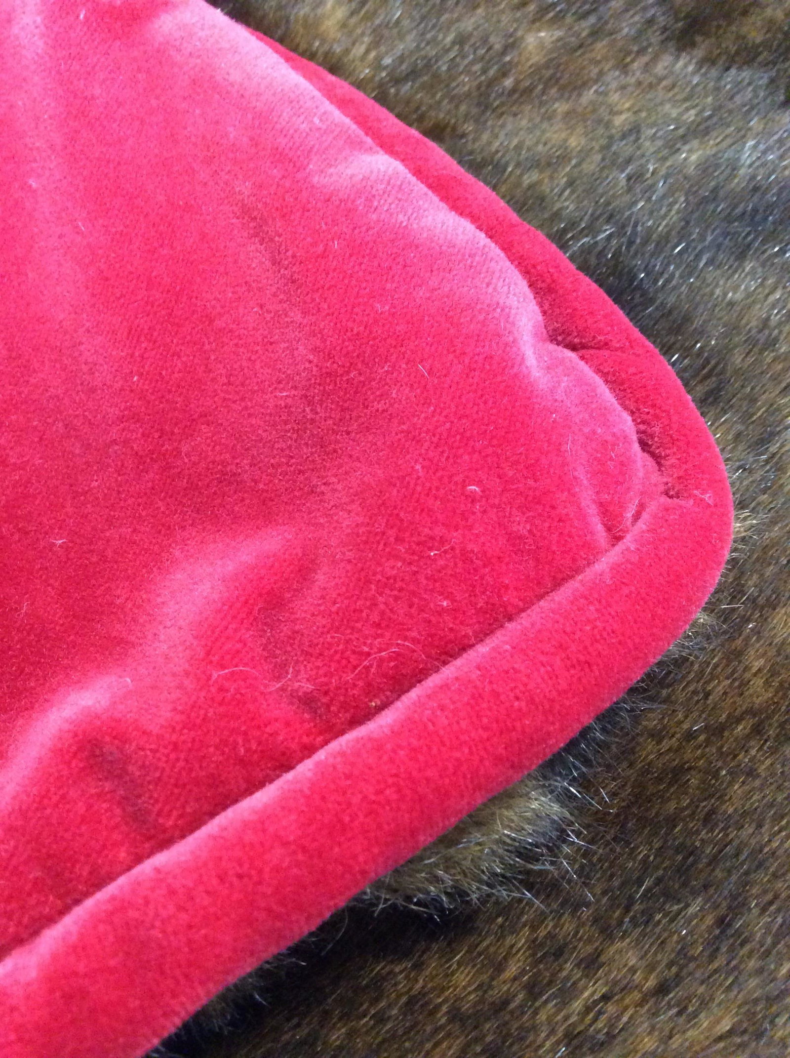Faux Fur Throw with Red Velvet: Luxurious faux fur throw, all red velvet on one side with velvet piping, other side Faux fur. 180 in. x 132 in. App. Weighted blanket. Like new.can be used as a twin bed cover, personal boudoir throw,