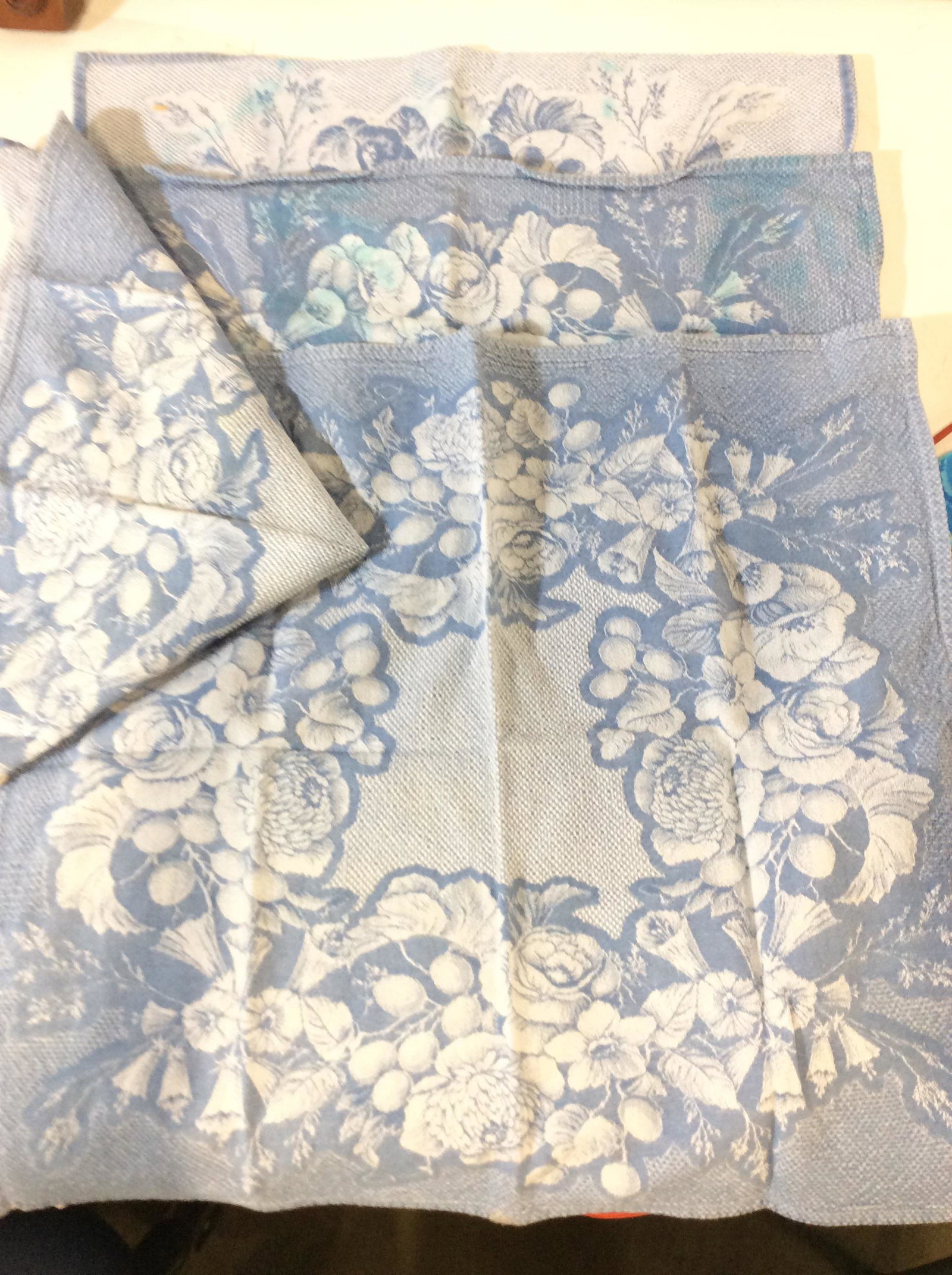 Vintage Le Jacquard Francois Table Linen Set, FR: Total 5 pcs. Country Blue with fruits, designer label, 100% cotton. 4 Matching napkins , 1 has bright blue blemish. Tablecloth measures app 55 in. x 58.5 in. spotting consistent with use . Made in Fra