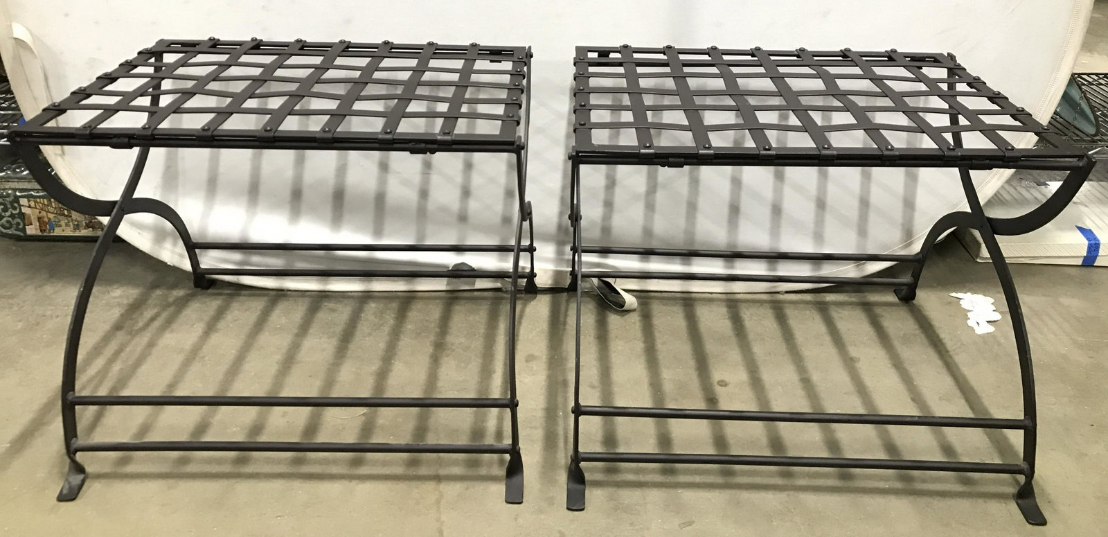 Pair RESTORATION HARDWARE Metal Luggage Racks: Lot includes a pair of Restoration Hardware luggage racks. Each are bronze toned and metal. Each have woven metal detail at top. Racks are footed. Each measures approximately 19 inches tall 24 inches 