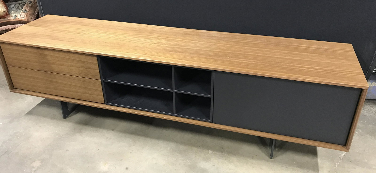 TREKU TV Stand: TREKU TV Stand. Drawers and door are secured with magnets, spring loaded push Openings. Drawers read as TREKU. Measures approx 20.5 inches H, and 77.25 inches W, and 18.75 inches deep. Wear is consist