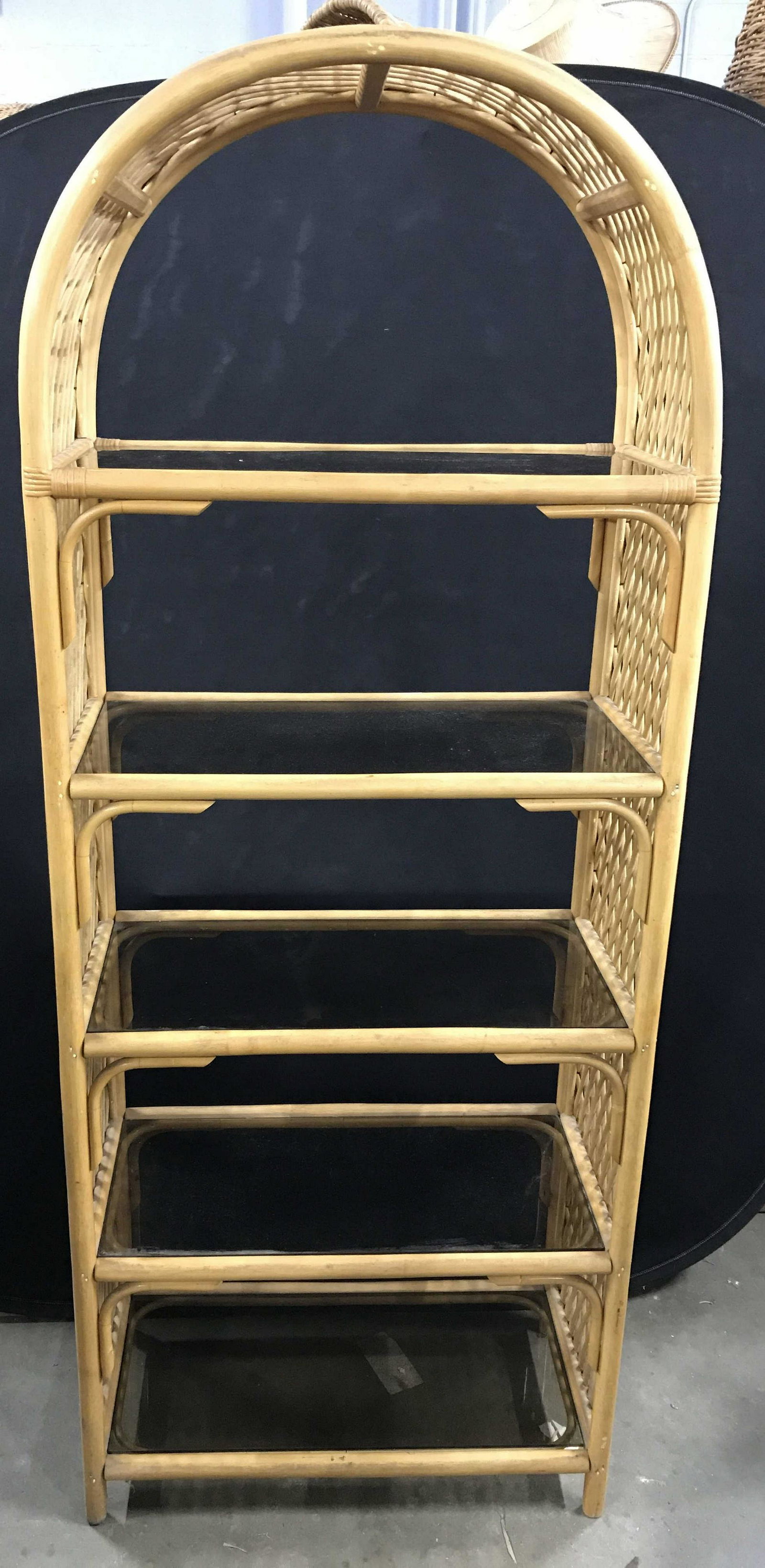 Vintage Rattan Rack & Glass Shelves: Vintage rattan display rack. Shelves are glass and colored a Smokey grey. Measures approx 75.75 inches H, 30 inches W, and 15 inches deep. Wear is consistent with age and use. Vintage furniture, vinta