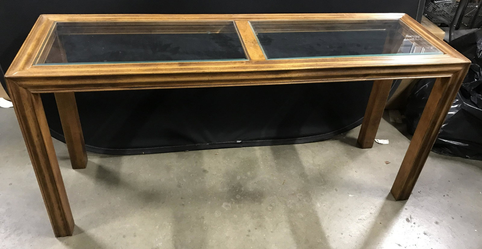 Vintage Wooden Console Table: Vintage glass topped console table, two lanes of glass make up table top. Measures approx 26 inches H, 54.5 inches W, and 16.5 inches deep. Wear is consistent with age and use. Vintage table, glass to