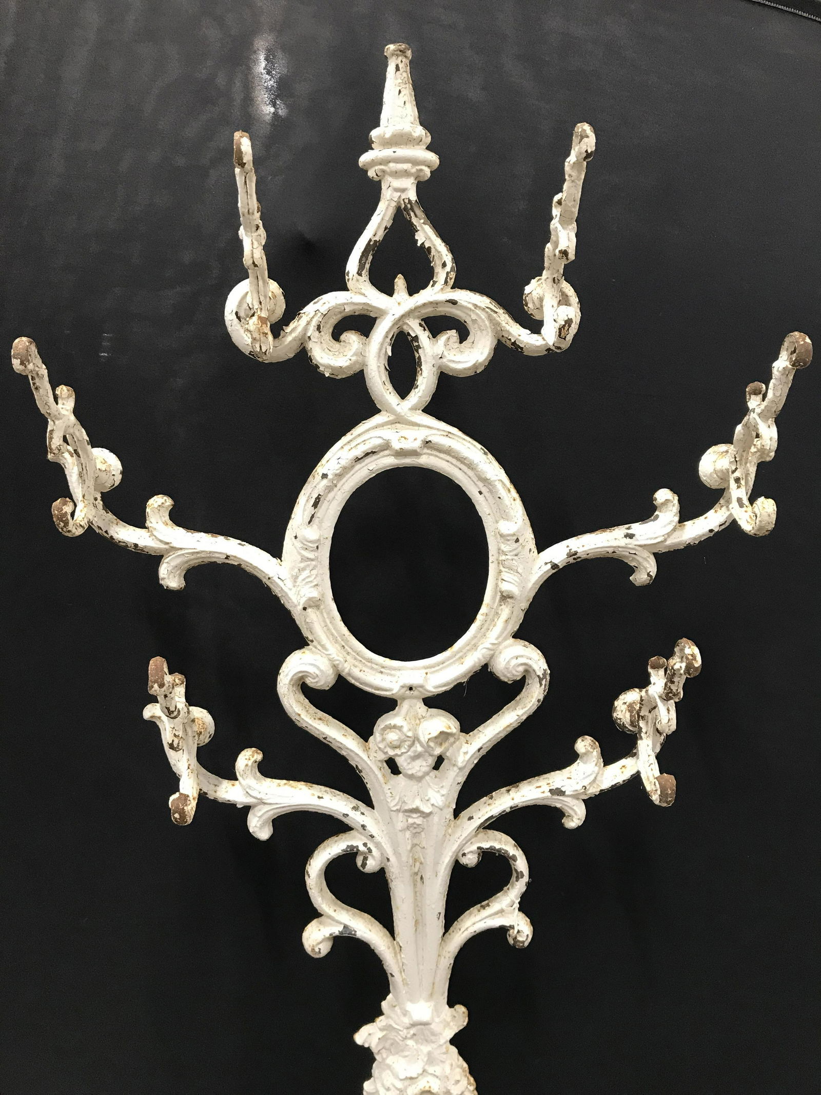 Antique Metal Coat Rack Hall Stand: Coat rack is vintage Possibly antique. Piece is cream toned. Piece measures approximately 74 Inches tall 26 inches wide 11 inches deep. Piece has evident wear. Coat rack, metal coat rack, vintage coat