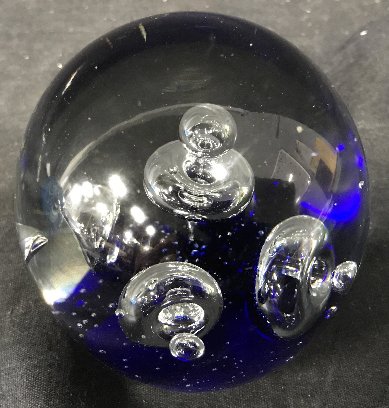 Blue Bubbled Art Glass Paperweight: Blue bubbled art glass paperweight, a spherical paperweight with a flat bottom, interior has a blue bottom and various bubbling inside, measures 3.75 inches tall, Art glass, paperweight, glass paperwe