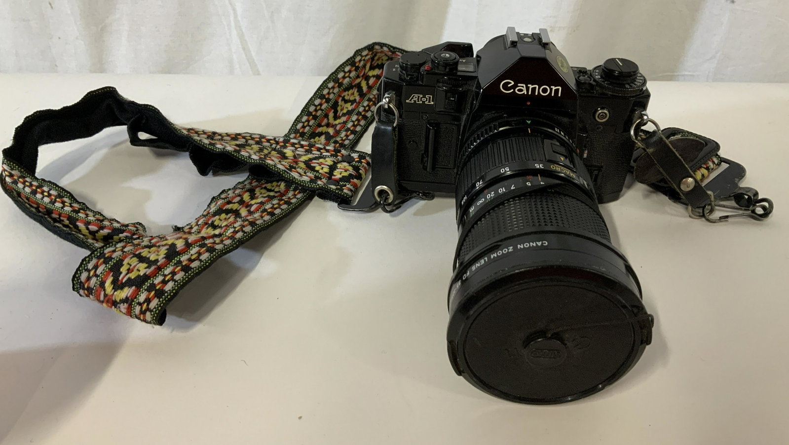 Vintage Cannon A-1 SLR Camera: Vintage Cannon A-1 SLR Camera, inscription reads ‘Canon A-1 Japan 2300762’, Measures 3 5/8 inches tall x 6 3/4 inches at widest point, has some scratches but overall in good condition, Vintage, ca