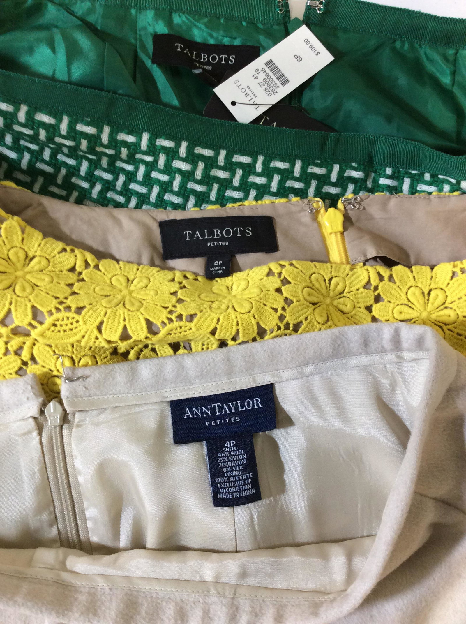 Lot 3 Designer Skirts, A. Taylor, Talbots, Org Tag: ANN TAYLOR PETITES, Beige WOOL SKIRT, SZ 4 petite. Embroidery and sequin design on lower hem. Length 30 in. TALBOTS PETITES, Sz 6P, Pierced Floral Embroidery with nude lining. Has original Tag. 21 in 