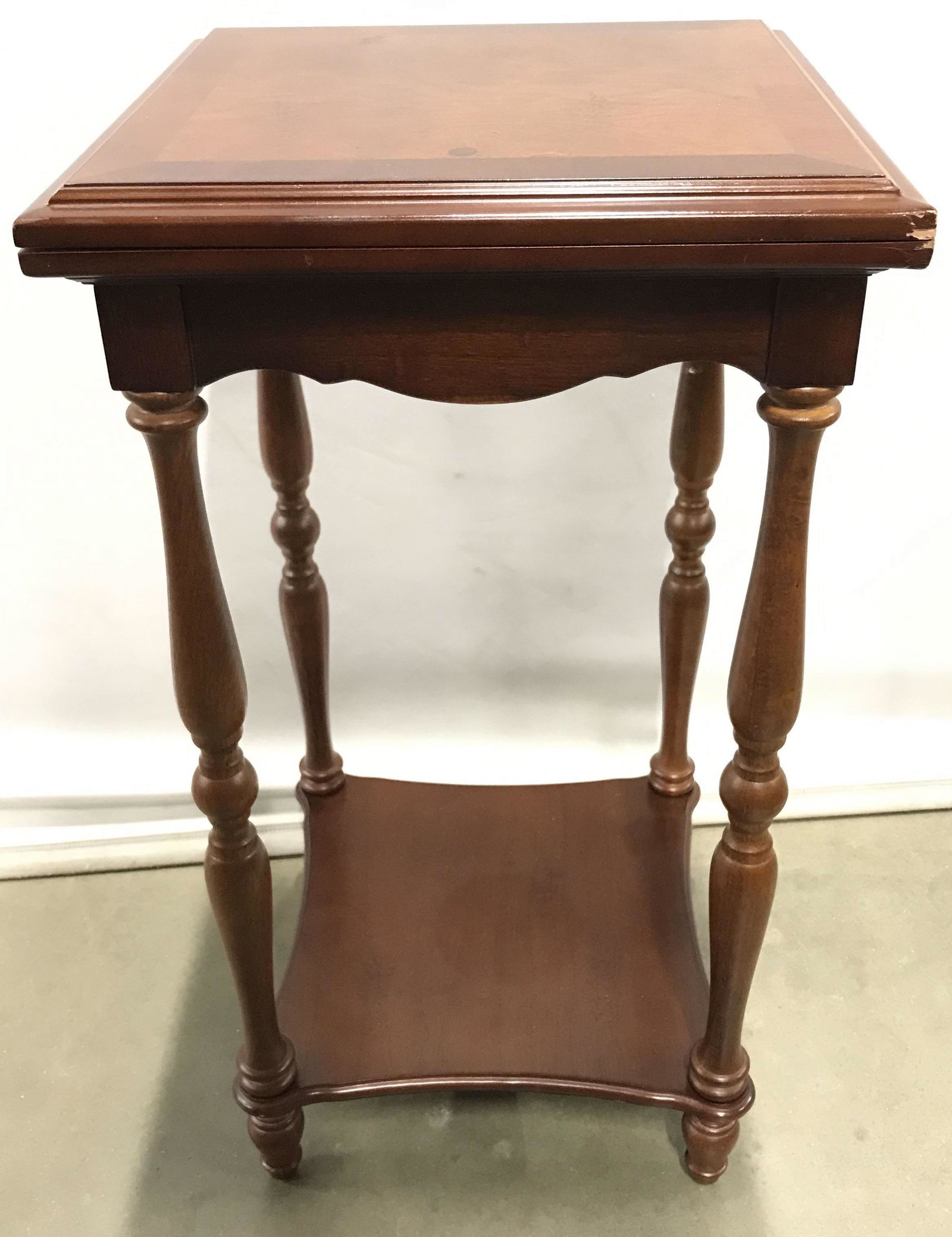 Carved Wood BOMBAY Extending Side Table: Carved wood side table, possibly vintage. Legs are turned, and supported by a stretcher. The tabletop can slide on a track and open to extend, through the use of a hinge. Measures approx 24 inches H, 