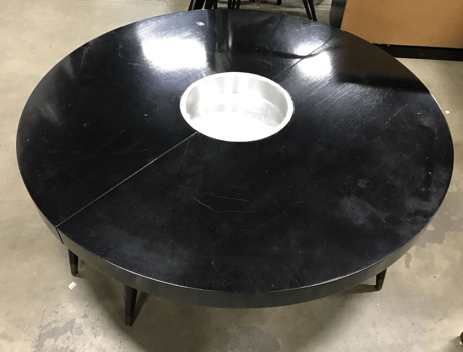 MCM Metal Centered Circular Drinks Table: Vintage coffee table with ice bucket insert, or use for plant, interesting design element. Black toned wood coffee table, table splits down the center. Ice bucket is metal with a brushed metal finish.