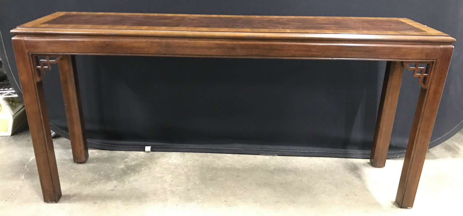 DREXEL FURNITURE Vintage Wooden Console Table: Underside has tag which reads DREXEL HERITAGE Console table is wooden. Piece is brown toned. Corners between top & legs have carved wooden geometric detail. Table top may be inlaid. Piece measures app