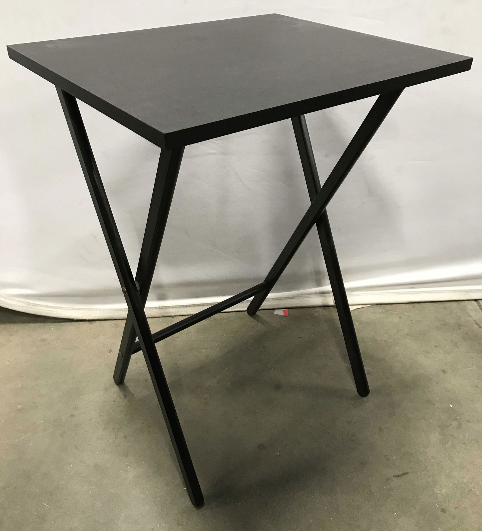 Lot 5 SCEIBE Black Toned TV Tables & Stand: Lot includes 4 TV tables. Each are black toned. Tag on undersides on tabletops read SCHEIBE. 1 table measures approximately 26 inches tall 19 inches wide 16 inches deep. Tv tables, snack tables, dinne