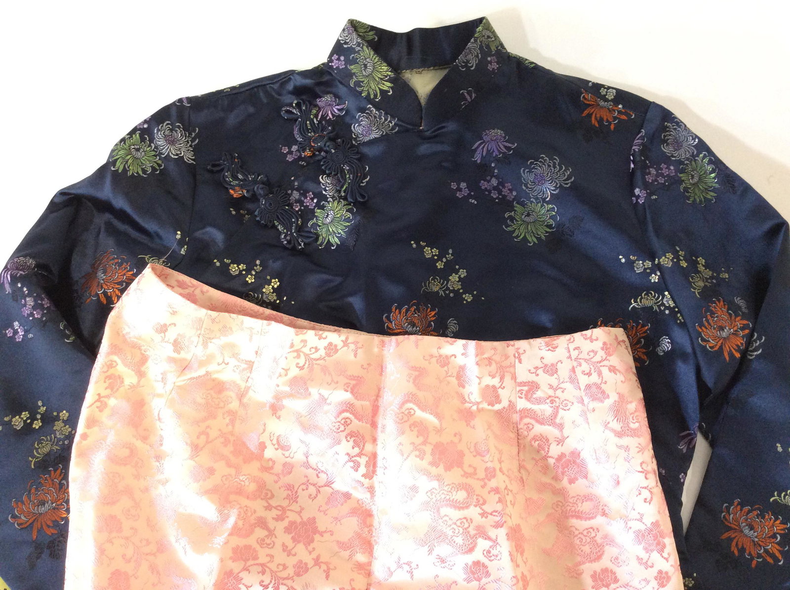 Lot 2 Traditional Chinese Qipao & Trouser: Cocktail Wear Separates. Navy blue with colorful roses. Sz Small, waist 26 in, across Shoulder app 14 in. Zipper On Side, snaps up Chest to Neck, side slits for walking. Designer PAULE VASSEUR Pink ac