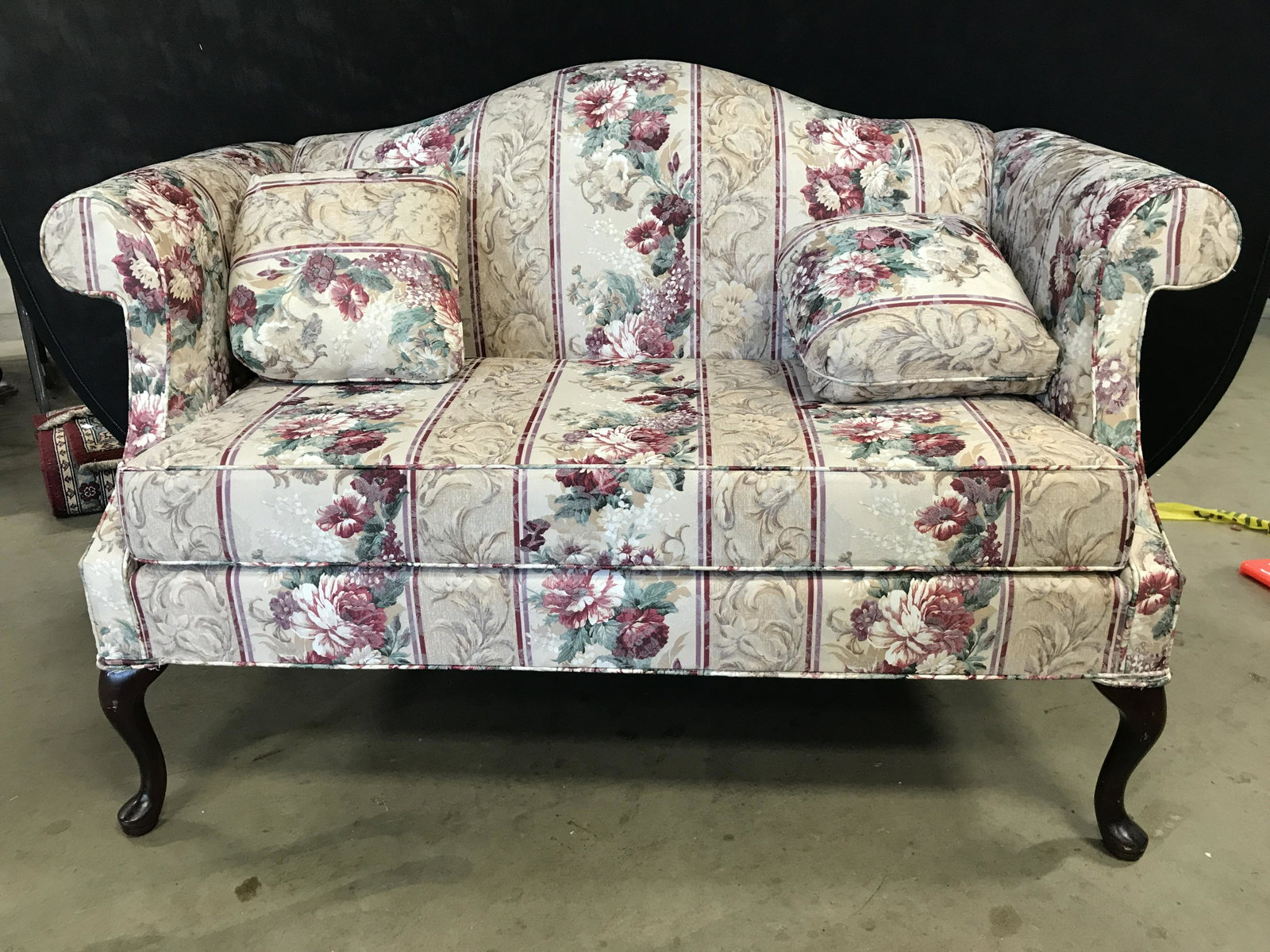 CRYSTAL FURNITURE Floral Detailed Upholstered Sofa: Underside of piece has tag which reads CRYSTAL FURNITURE DIST. Piece has intricate multi toned floral leaf & geometric upholstered detail. Sofa has 2 carved wooden Cabriole legs. Sofa, loveseat, couch
