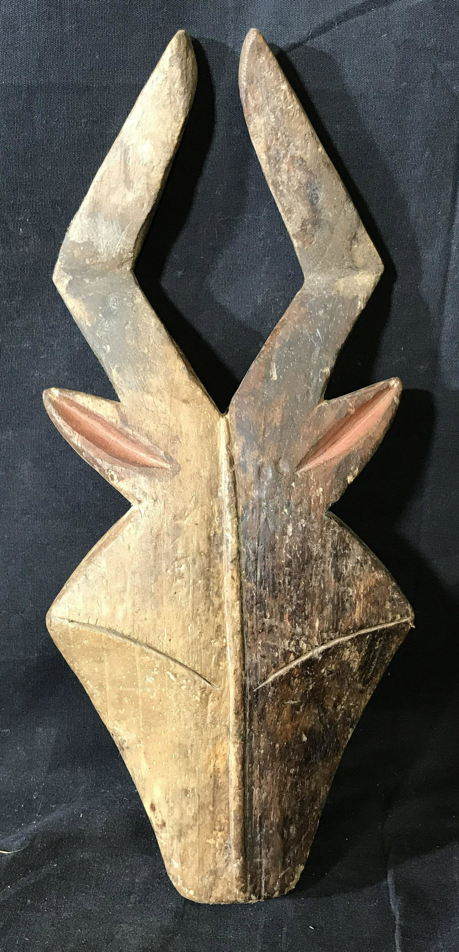 Gabon Kwelet Mask: Gabon Kwelet Mask, origins can be found in Gabon Central Africa, hand carved from one block of wood, painted with brown red and black pigment, approximately 15 inches at tallest point and 6.25 inches 