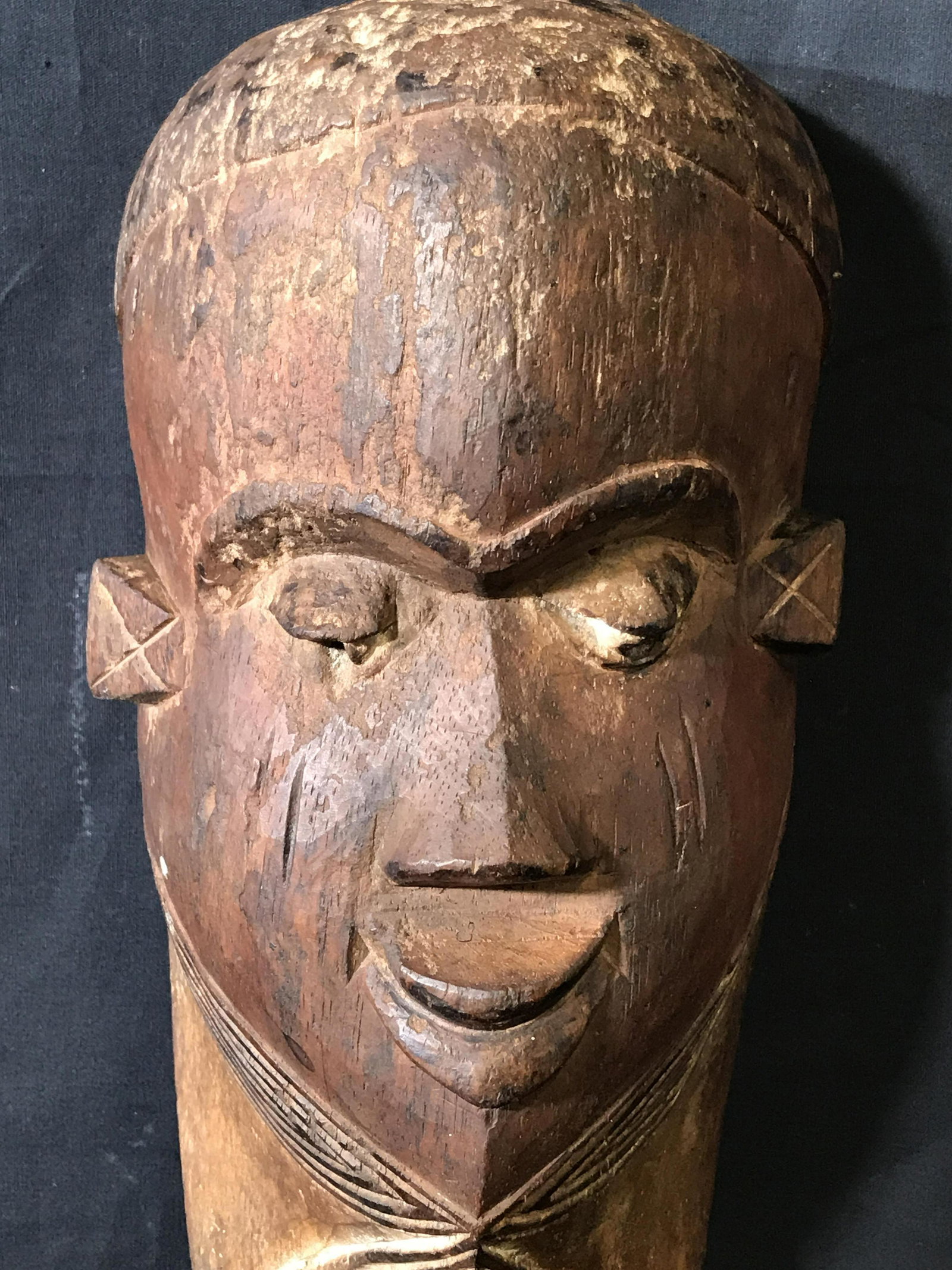 Long Pende Mask: Long Pende Mask, origins found in what was previously known as the Republic of Zaire a section of land that is now apart of the Democratic Republic of the Congo, painted with red black and brown pigme