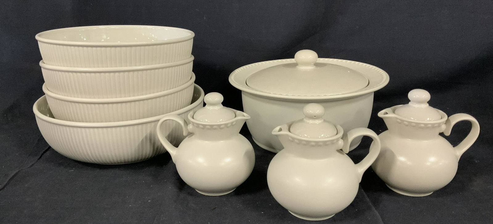 Lot 9 Dansk Ceramic Bowls and Teapots: Lot 9 Dansk Ceramic bowls and teapots, stamp to base reads ‘Dansk International Designs Ltd Rondure Dinnerware MP Japan’, beige color, largest bowl measures 3 1/8 inches tall x 9 7/8 inches in dia