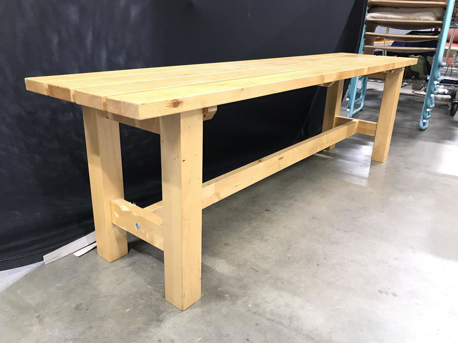 Outdoor Tan Toned Wooden Bench: Bench is tan toned and wooden. Piece appears to be for outdoor use. Upcycled indoor bench. Piece measures approximately 59 inches long 14 inches deep 18 inches tall. Bench, wooden bench, outdoor bench