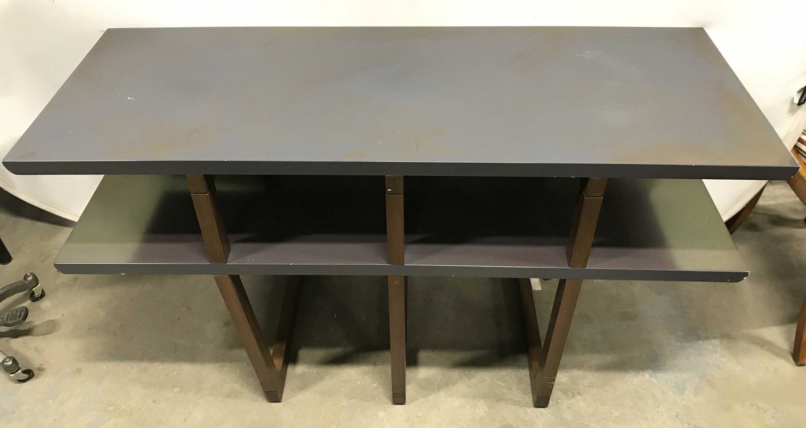 2 Tier Console Table: faux metal painted top to thick wood, and middle thick wood surface areas, modern style, sleek style, solid wood architectural style frames, Console table has 1 tier underneath tabletop. Piece has 3 w