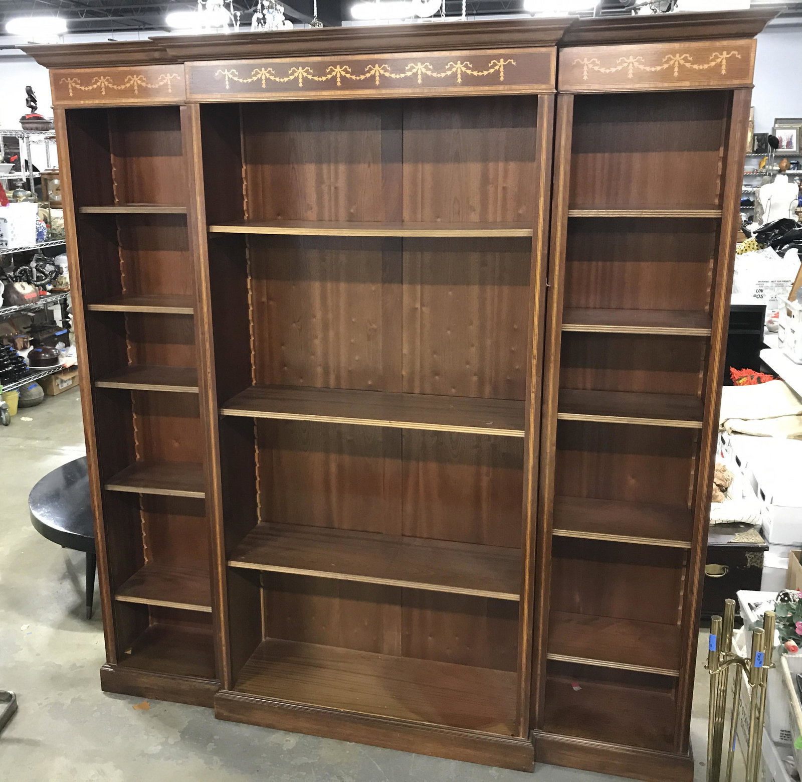 Vintage Wooden Inlay Book Shelf, ENGLAND: Vintage book shelf, crafted from wood. Detailing is crafted from multi toned inlaid wood. Shelves can be raised, lowered, or removed, includes 13 shelves. Measures approx 83.25 inches H, 80 inches W, 