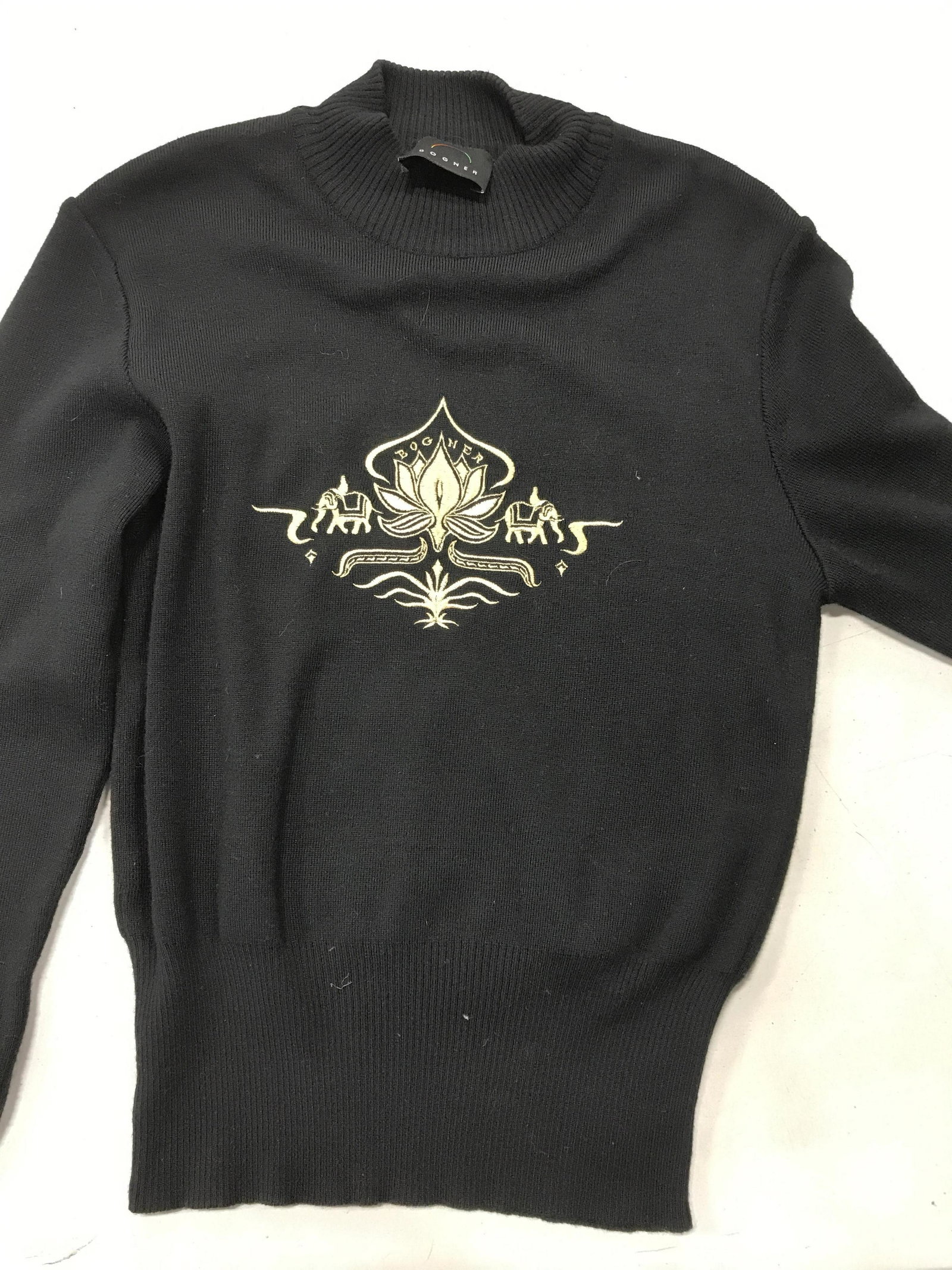 BOGNER Wool Knit Pullover Sweater: Black sweater, Size Med, mock collar, cinched ribbed waist, designer labeled, fabric label 50% wool, 50% acrylic. Good condition, Embroidered BOGNER design. Designer Brand, BOGNER Sweater, Wool & Acry