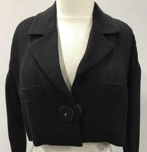 Prada Knit Viscose Crop Jacket: Luxury Prada black crop long sleeve jacket, for fashion, for evening, for comfort. Slight open weave viscose fabric, waist snap button, rolled cuffs. Designer label reads Prada Made in Italy. Size 38/