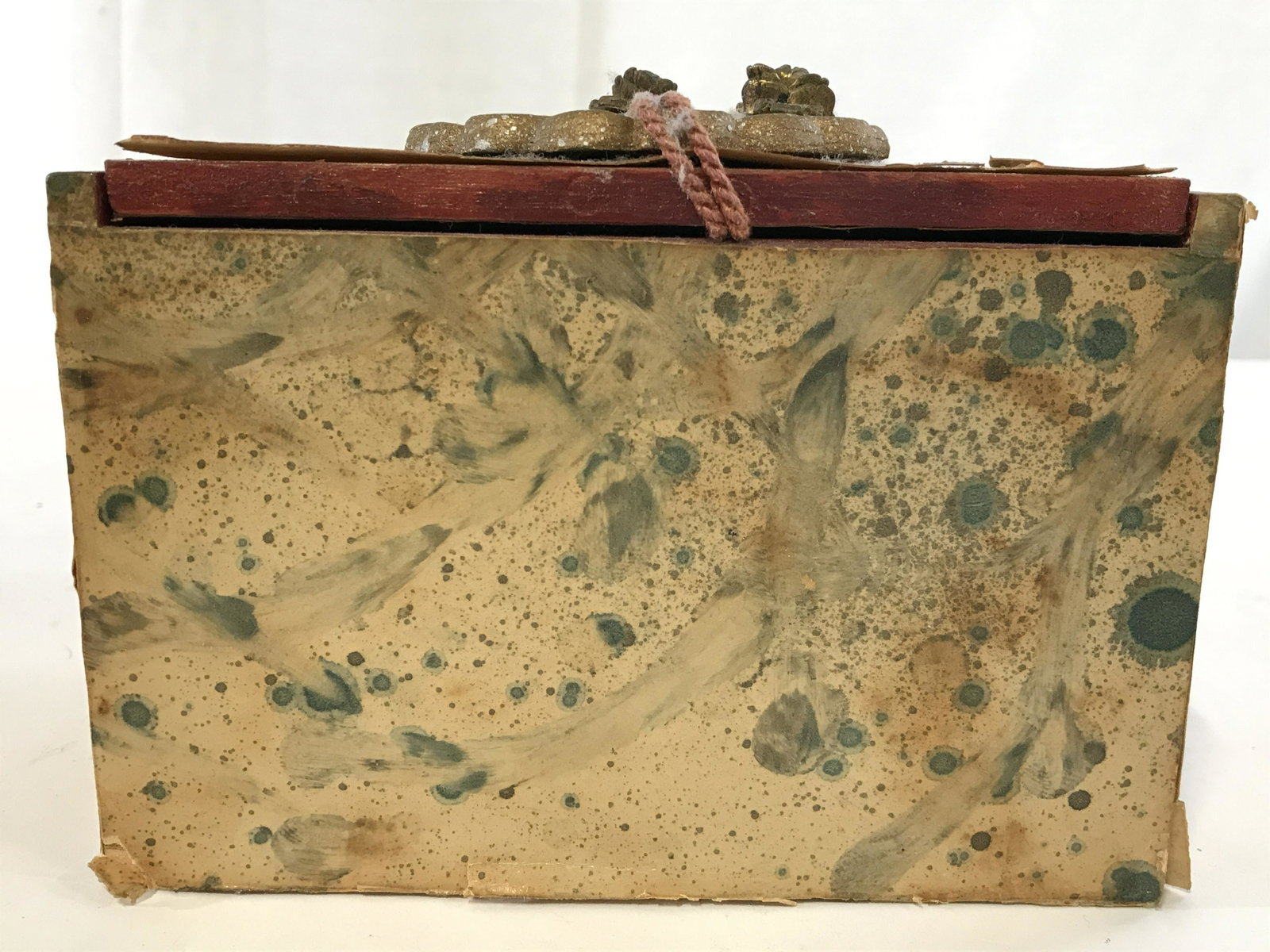 Vintage Signed Lidded Keepsake Box: Underside of trinket box is signed illegibly. Piece appears to have been covered in multi toned decorative paper. Piece measures approximately 6.5 inches long 4.5 inches tall and deep. Trinket box, je