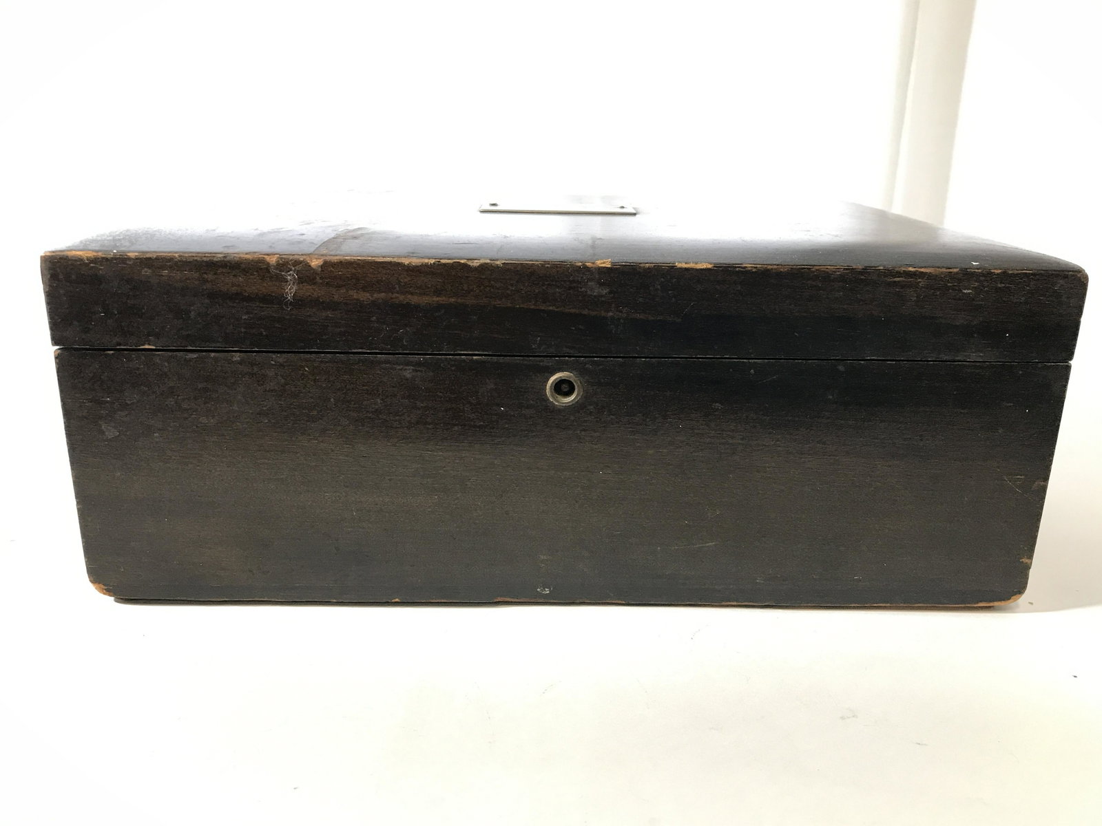 Vintage Brown Toned Wooden Keepsake Box: Keepsake box is brown toned and wooden. Piece has silver toned metal name plate on top of lid. Piece measures approximately 11.5 inches long 8 inches deep 4.5 inches tall. Keepsake box, cigar box, jew