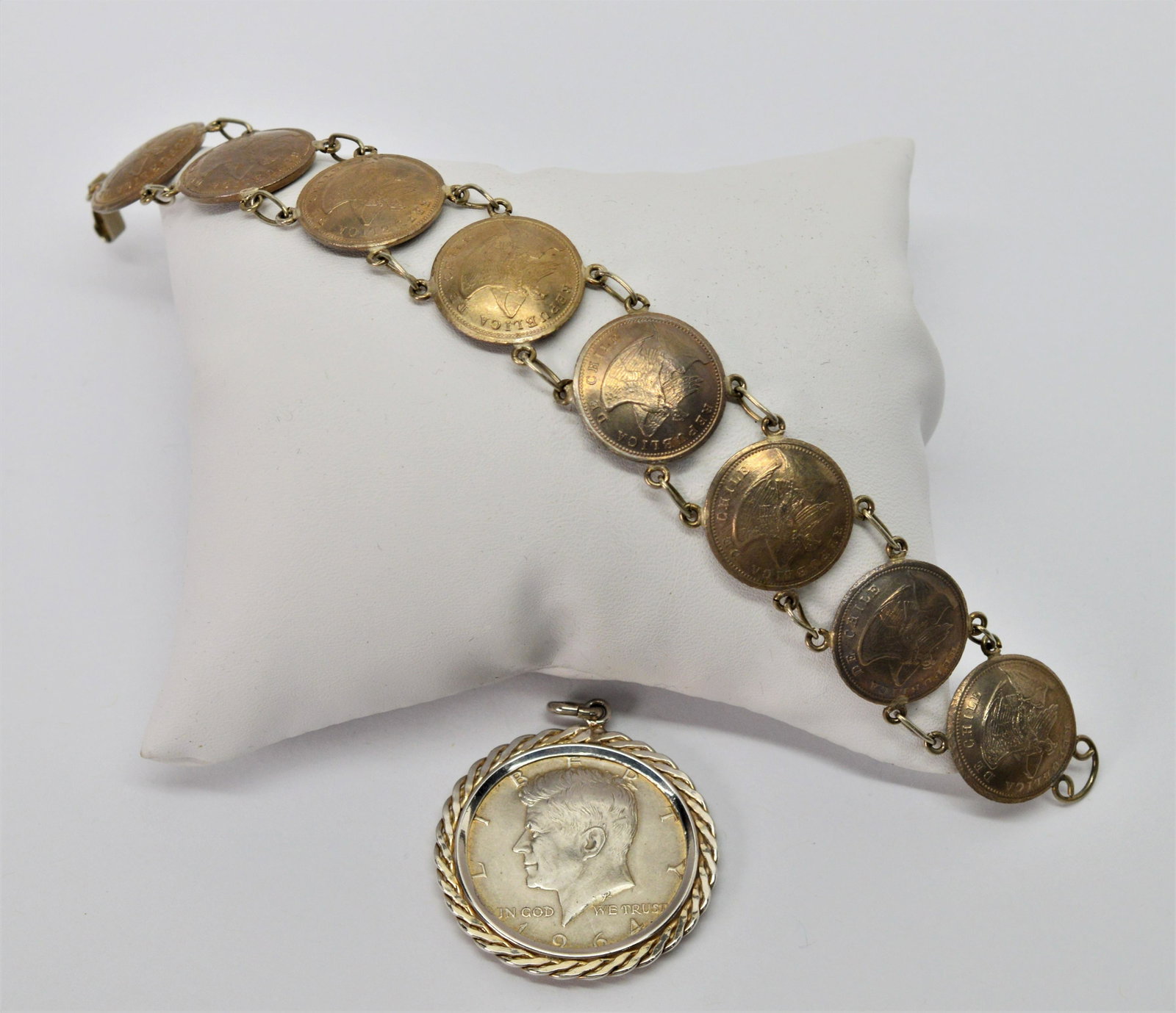 Silver Coin Medallion & Bracelet: 7" long bracelet. 1964 Kennedy Half Dollar set in .835 silver ready to hang; "Republic de Chile" copper nickel bracelet