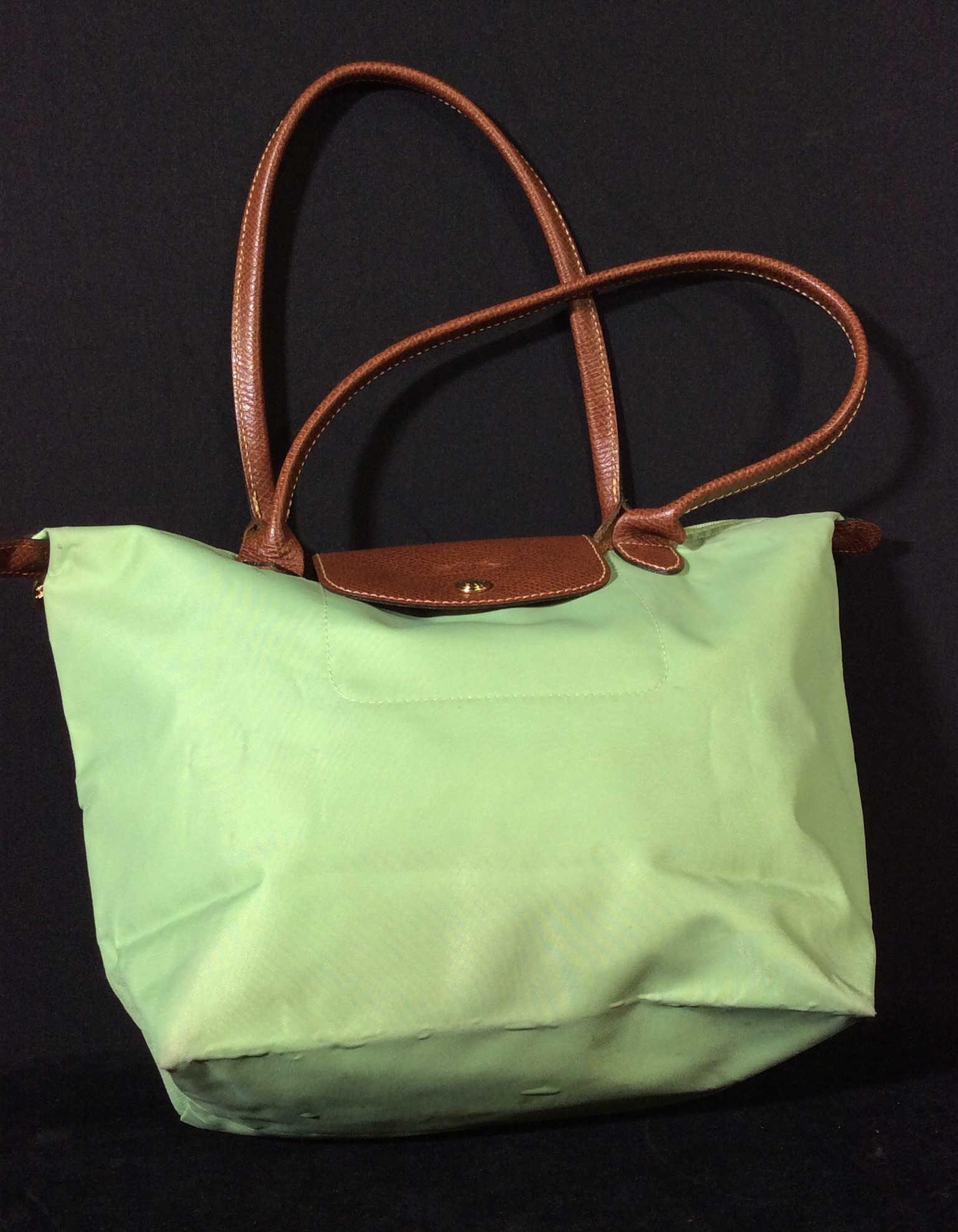 Collectible Vntg Longchamp Le Pilage Handbag, FR: Original label in bag reads MADE IN France 0679037 NCC SVB/02 2605089875. Light green color, all washable, leather Detail - Handles And flap, with Longchamp impressed logo. Labeled Accessories, includ