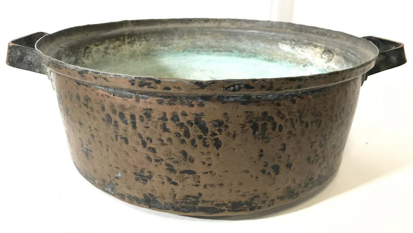 Antique Copper Pot W Handles: Pot is copper. Piece appears to be antique. Pot has 2 handles. Appears to be hammered copper. Piece measures 12.5 inches wide 4 inches tall 10 inches deep. Copper pot, antique pot, antique copper pot,